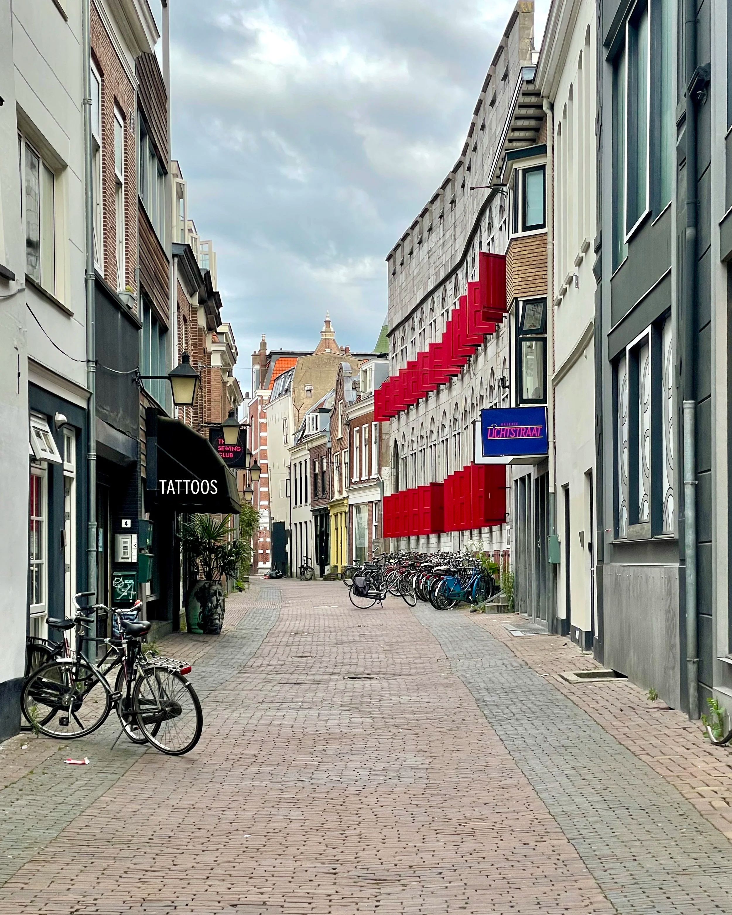 Utrecht Shopping street shows medieval architecture.
