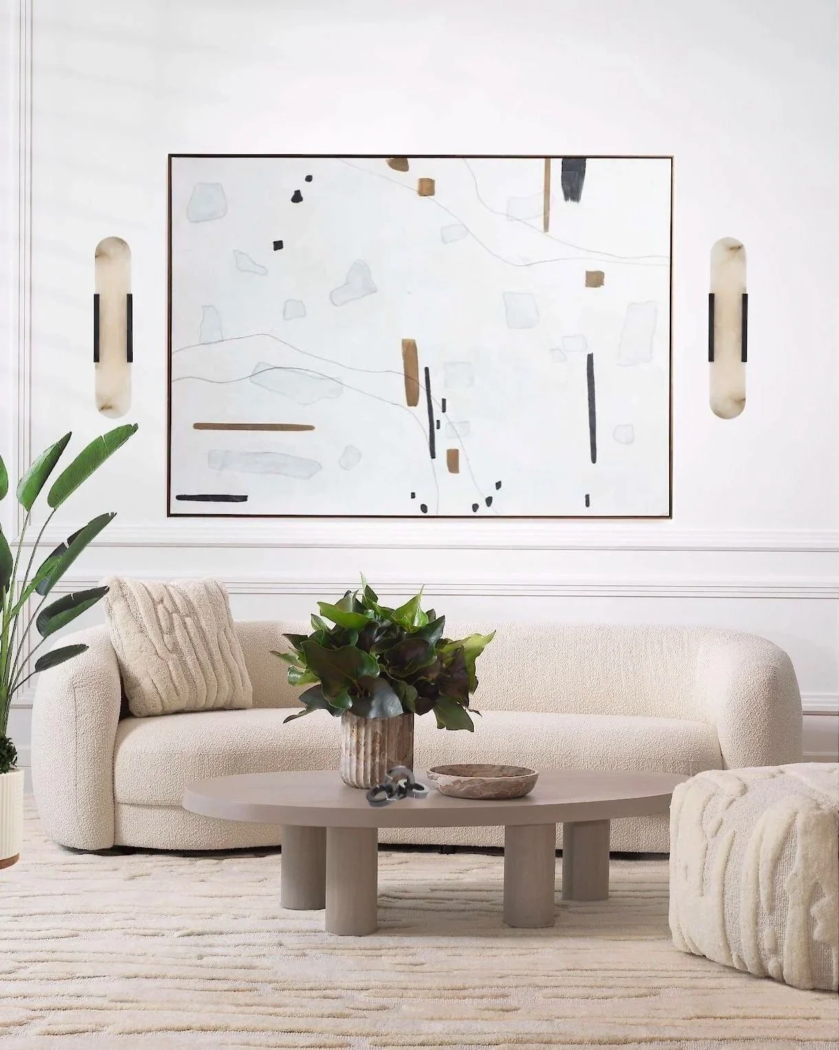 This Palm Beach modern living room interior design shows an European influenced style, neutral curved sofa, abstract art, marble sconce lighting, and a low coffee table on a textured rug