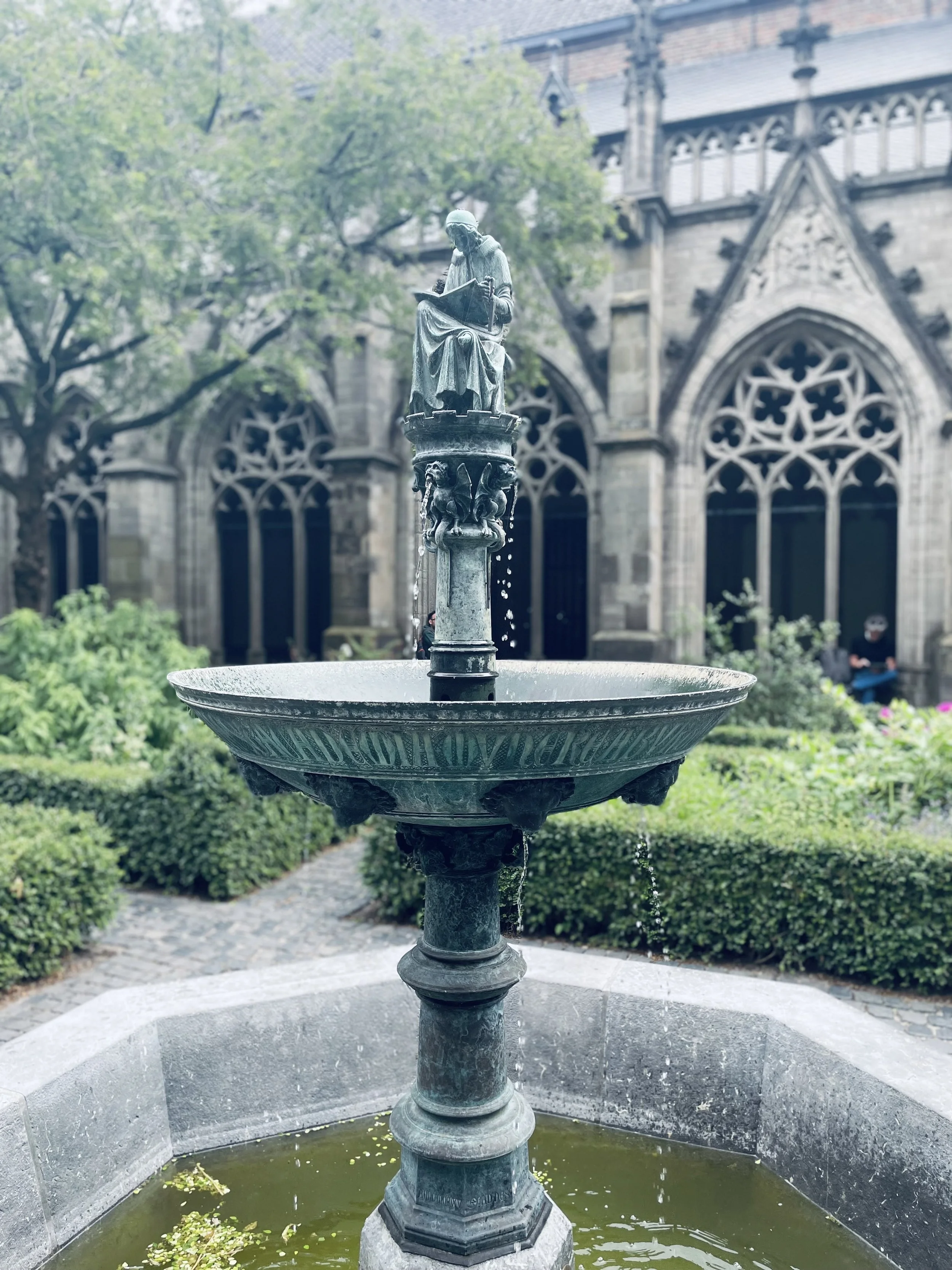 Pandhof van de Dom is a beautifully preserved 15th century cloister garden, close up of beautiful verdigris fountain.