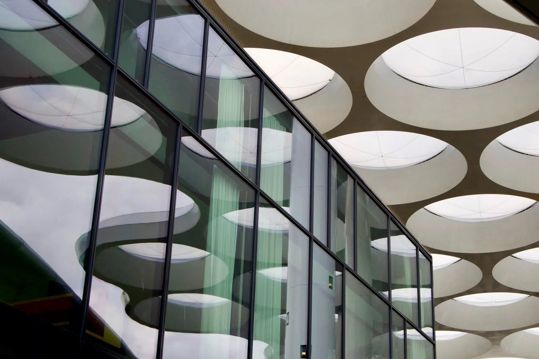 The airy canopy by the Utrecht train station layered over the contemporary mall.