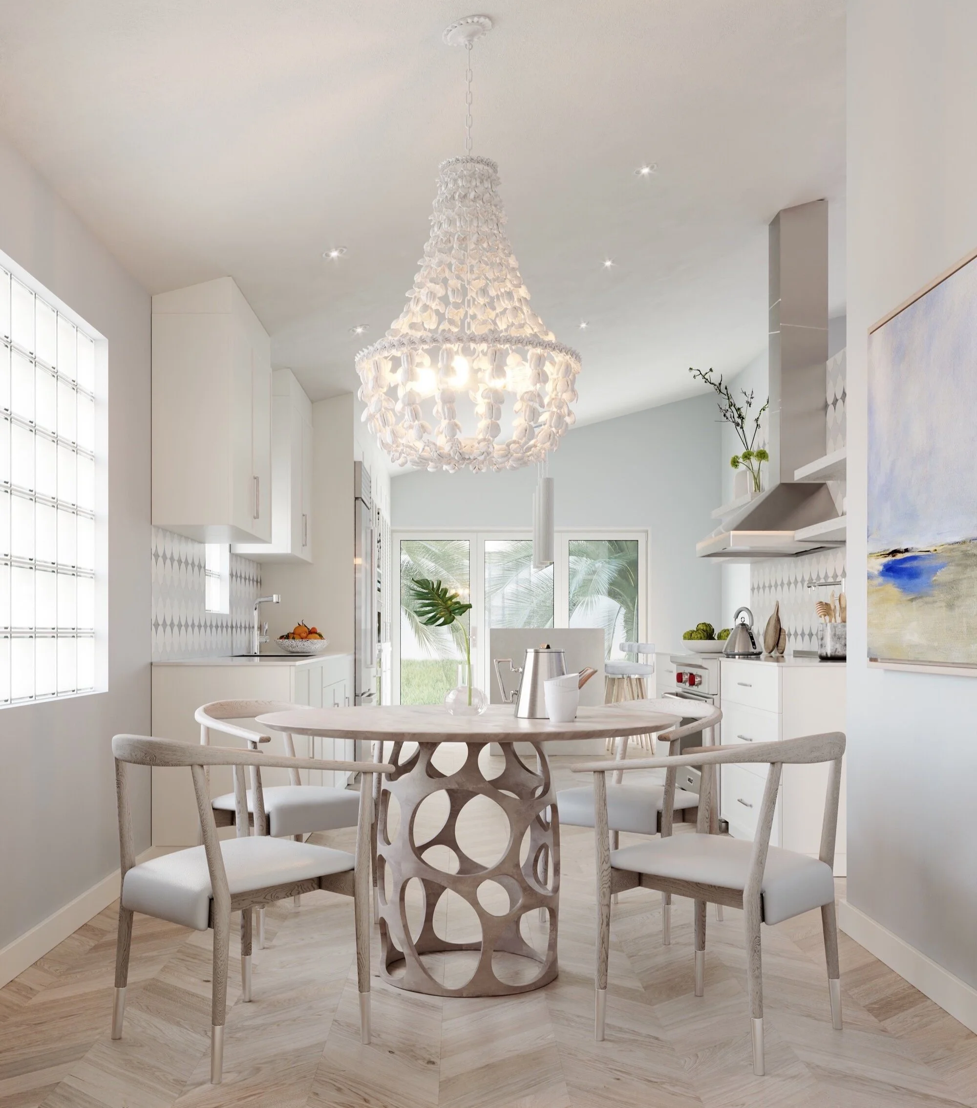 This luxury coastal kitchen design by Domaine Luxe shows the eat in kitchen area, looking towards the marble prep and entertaining areas. Real wood herringbone floors, pale oak furnishings, a natural influence chandelier, with modern art is seen.