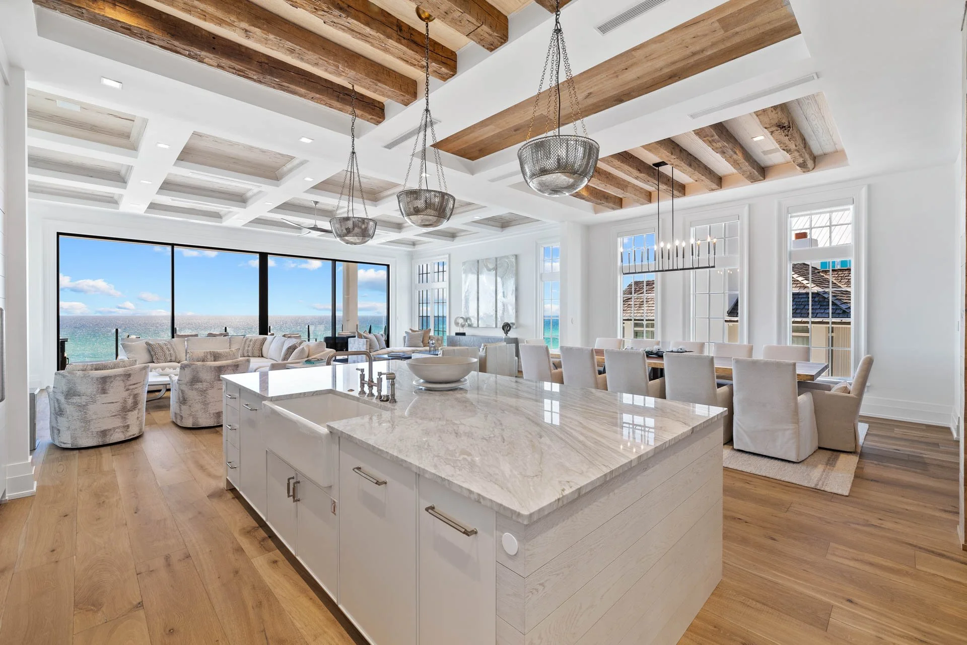 Coastal luxury open kitchen and dining with Palm Beach ocean view