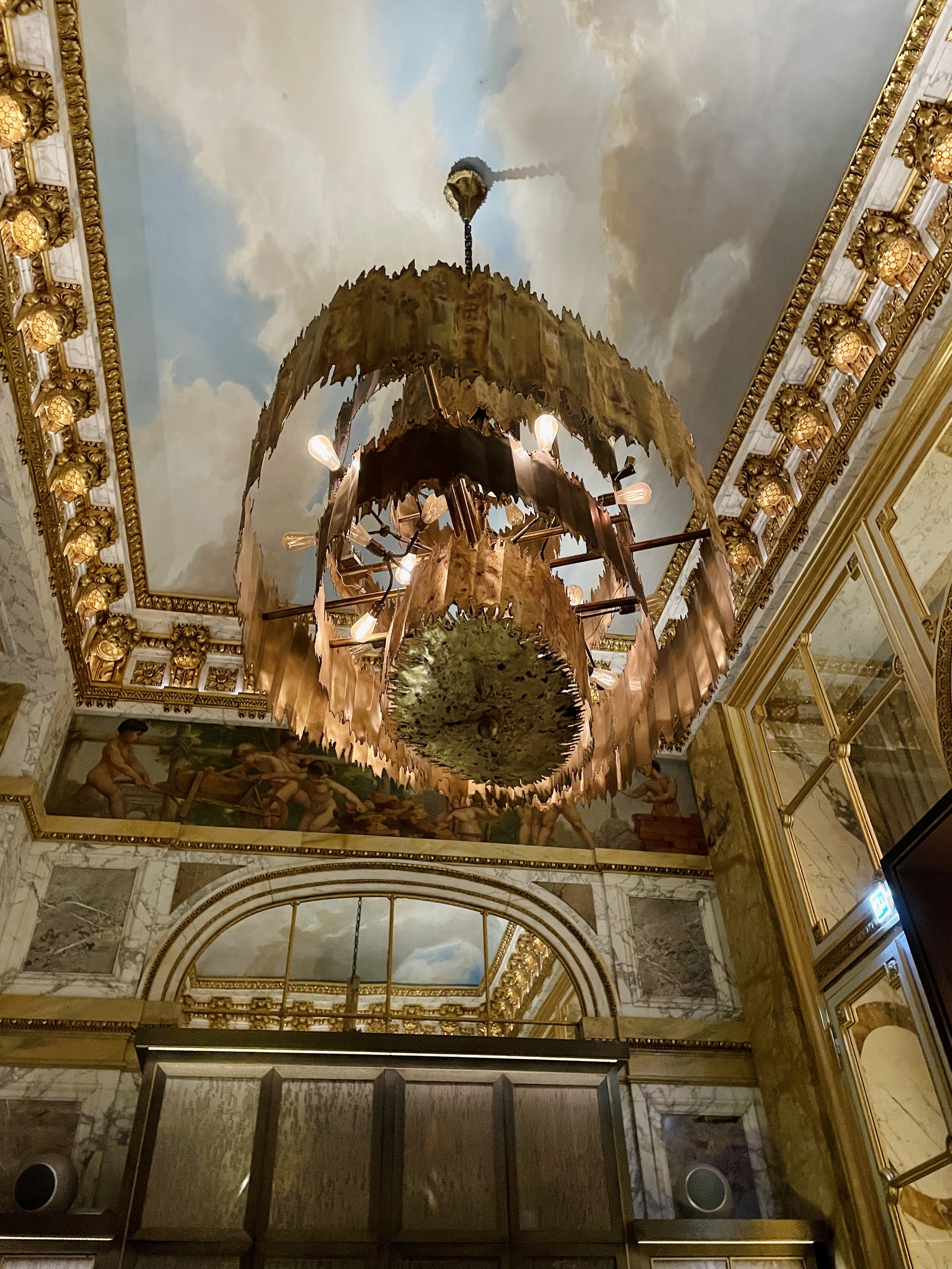 A modern chandelier graces the 1758 old Parisian palace.