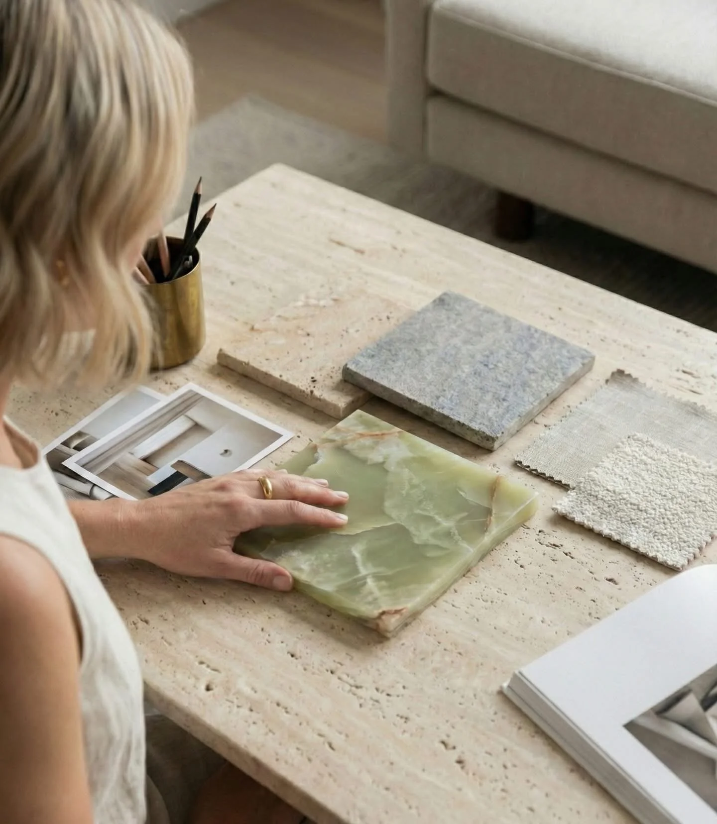 Interior Designer seen working with finishes for a design plan.