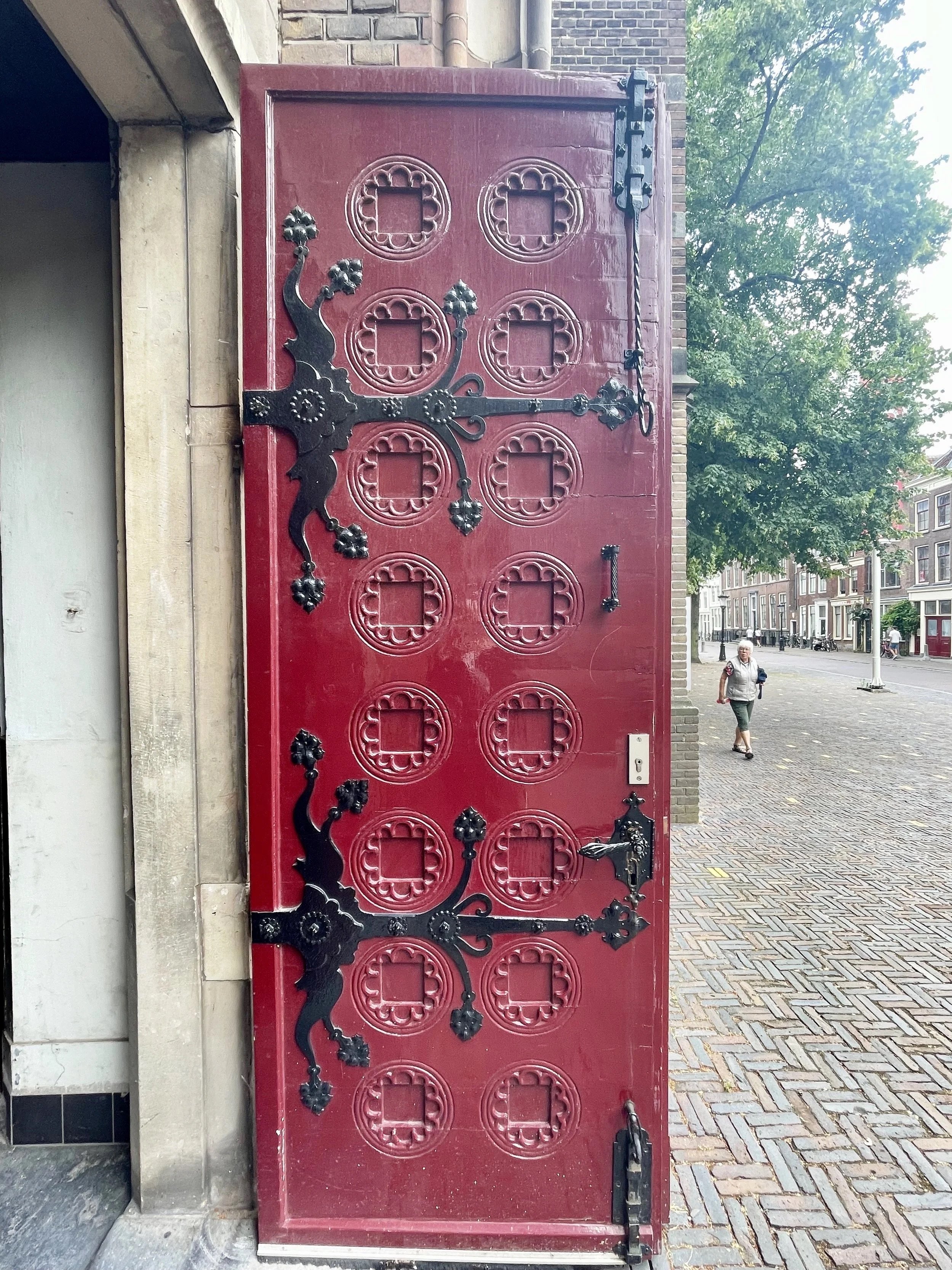 Utrecht's St. Catherine's Cathedral red painted front doors detail.