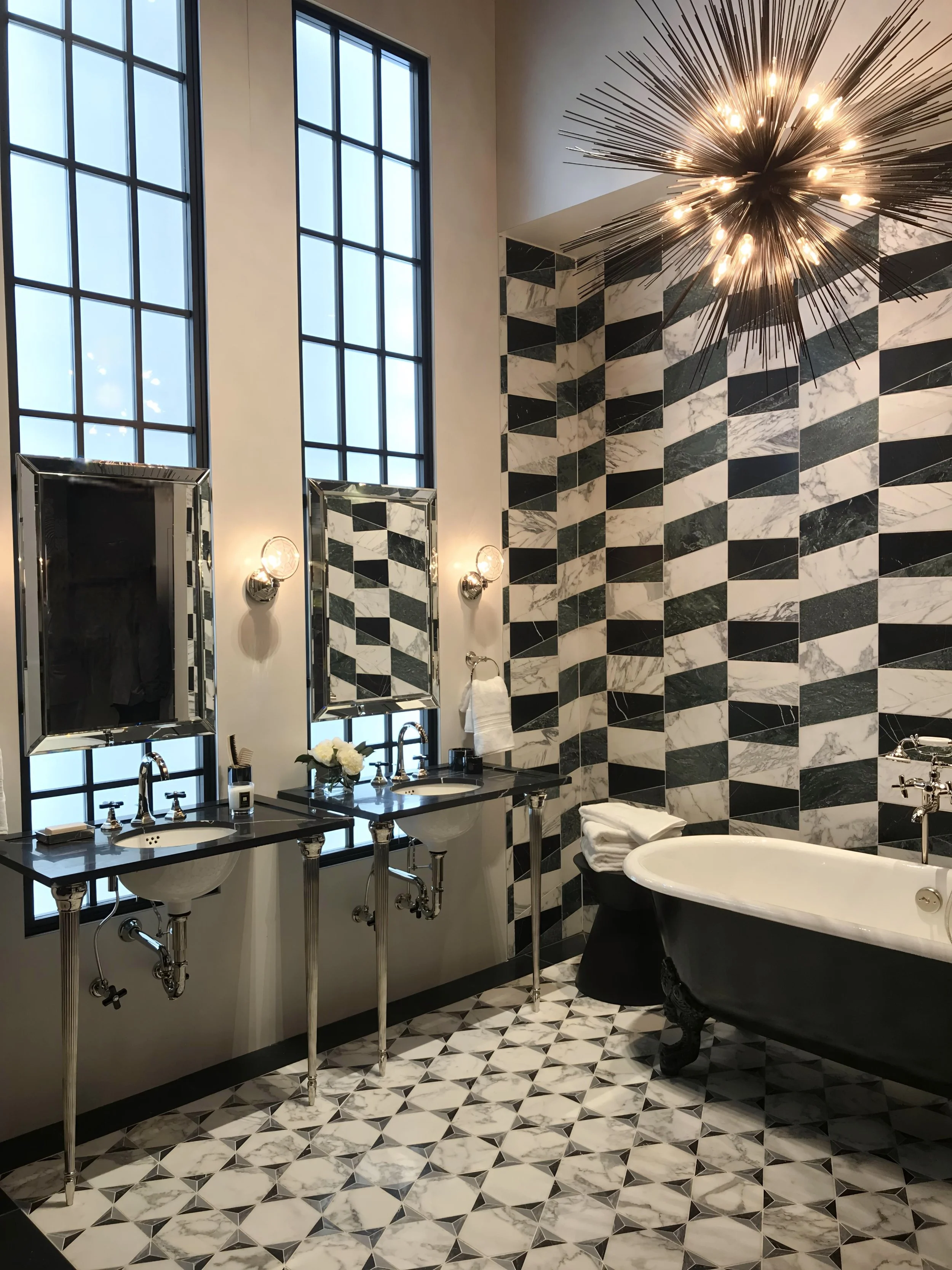 This Palm Beach luxury interior design bath by Domaine Luxe shows how timeless materials of black and white marble feels curated, livable luxury in a spa bath.