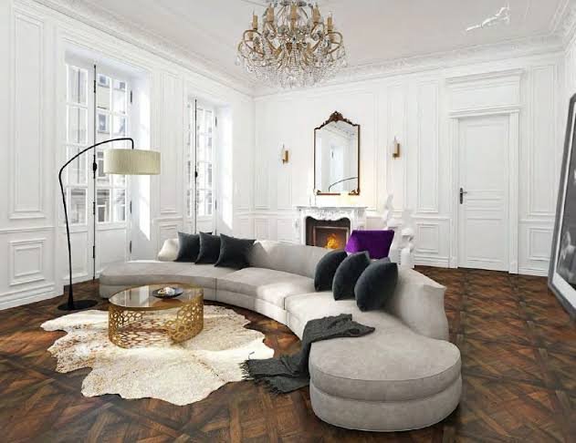 Palm Beach living room with expansive natural light, layered lighting, and garden views.