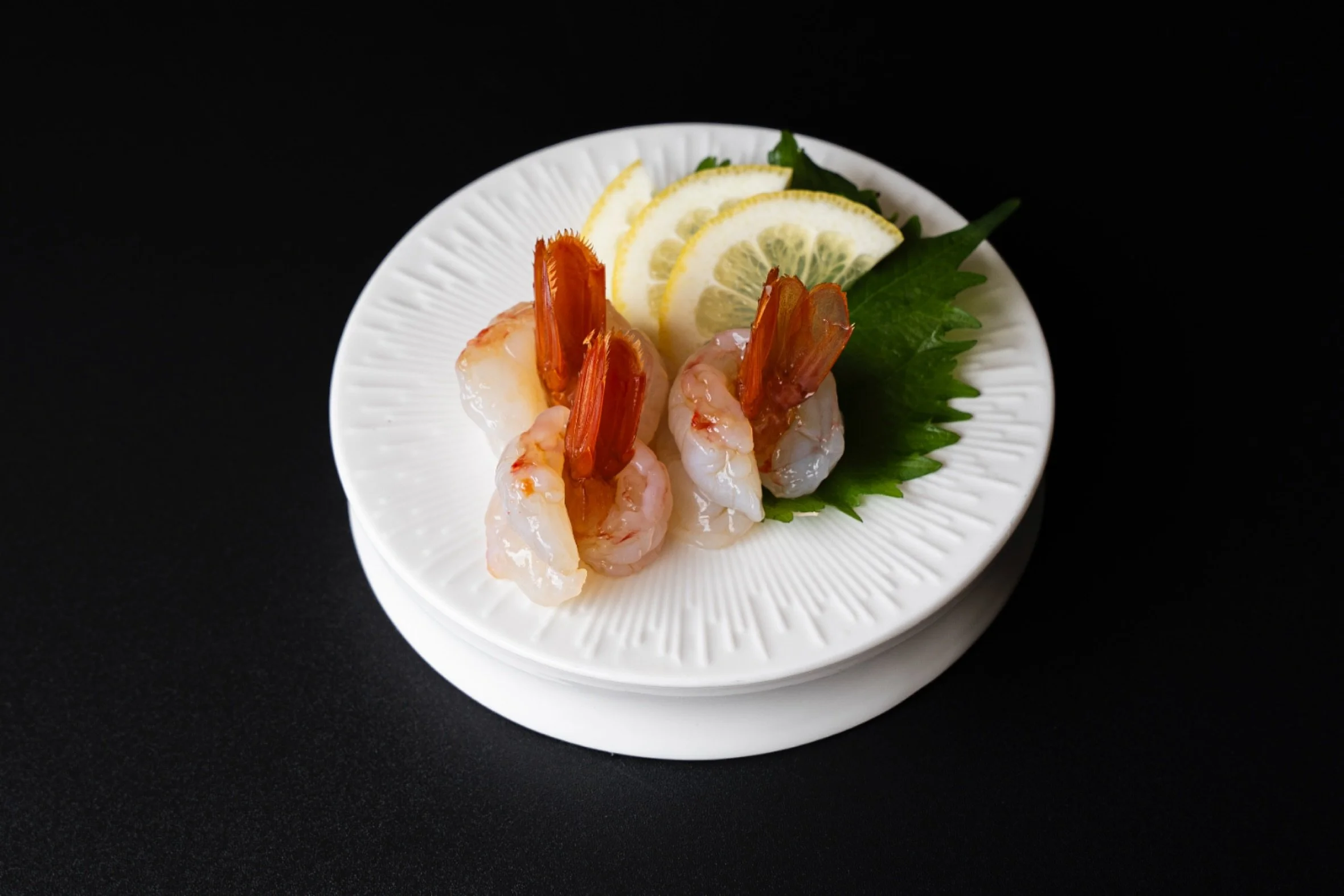 Amaebi or sweet shrimp is prized for its natural sweetness, delicate texture, and melt-in-your-mouth softness. Served fresh, it carries the pure taste of the ocean and is often enjoyed with a touch of soy or a hint of wasabi to balance the flavor. Ev