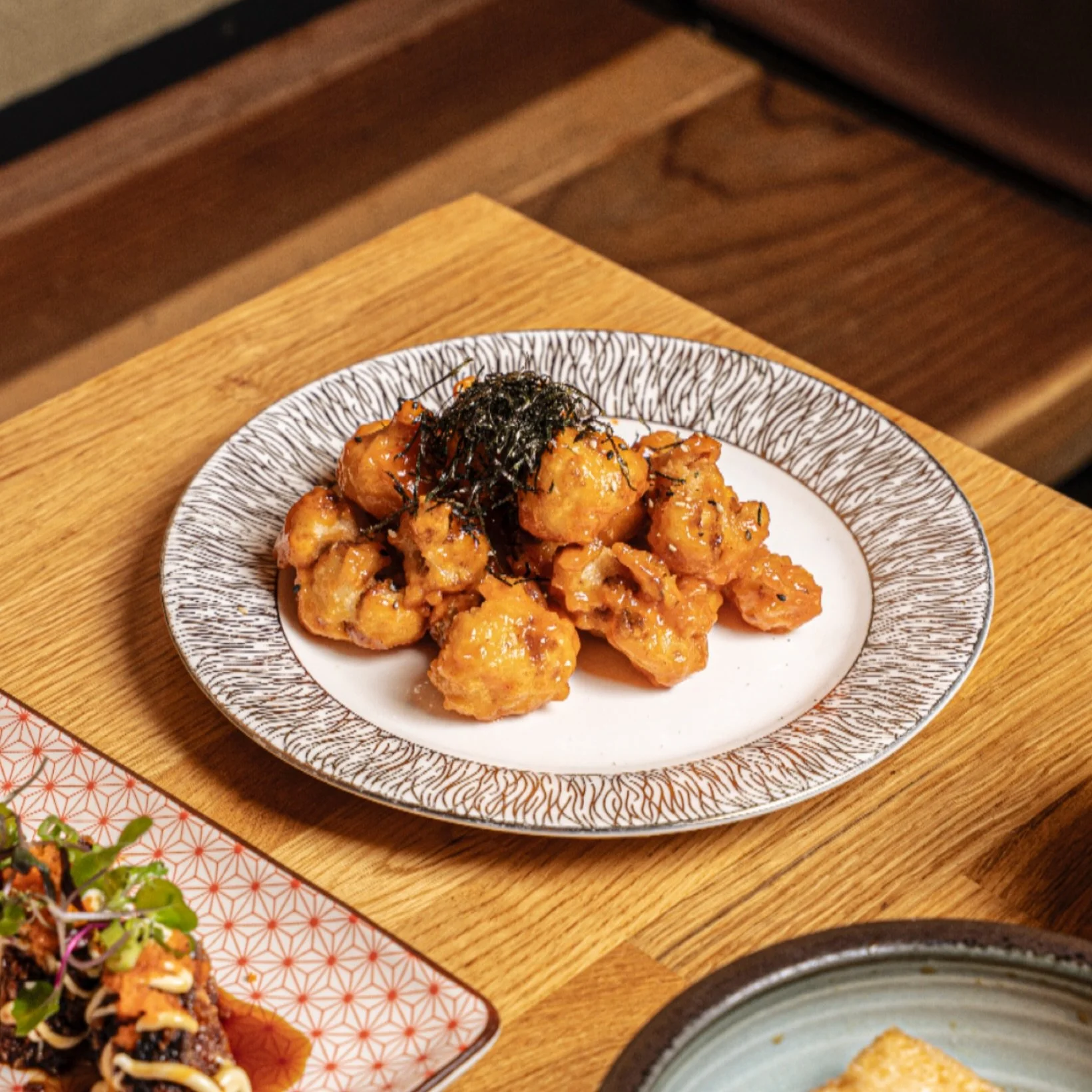 Cauliflower Karaage (VG) 🌱✨ Crispy rice flour cauliflower tempura tossed in spicy almond aioli, finished with kizami nori and furikake. Crunchy, spicy, and full of flavor &mdash; a veggie treat at Izakaya Osen!

#IzakayaOsen #CauliflowerKaraage #Veg