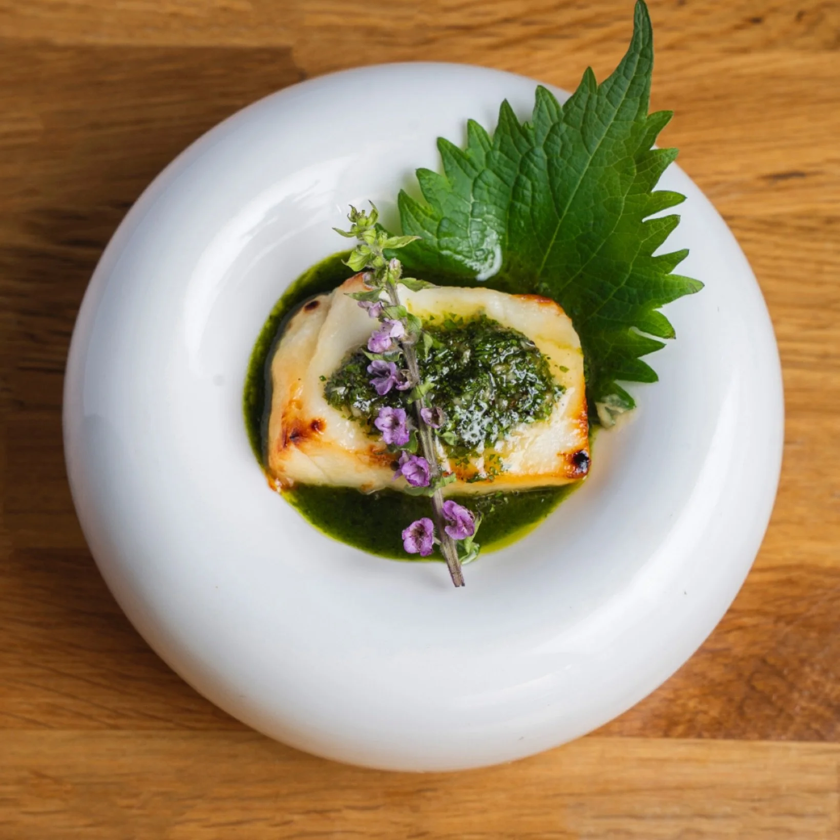 #DineLA 🫕 #Testingmenu 

🐟 MISO CHILEAN SEA BASS 🥢 Grilled miso-marinated Chilean sea bass, finished with our house-made parsley chimichurri