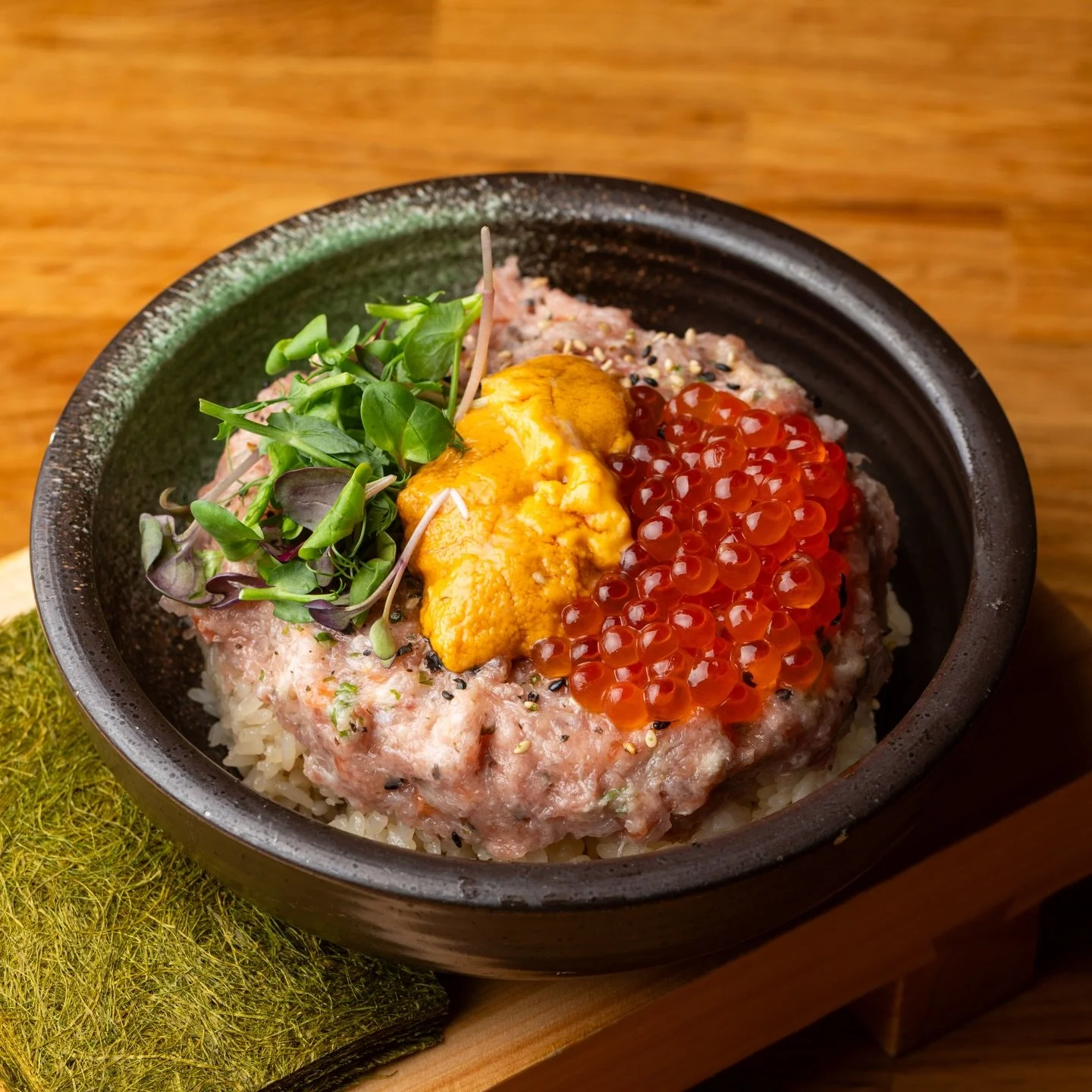 Omakase Bowl 🍣

Chef&rsquo;s choice of chopped and mixed seasonal fish, sea urchin, caviar, blue crab, salmon roe, and a touch of sesame oil over perfectly seasoned sushi rice 🌊✨

Served with a side of organic Kajime nori for that extra umami punch