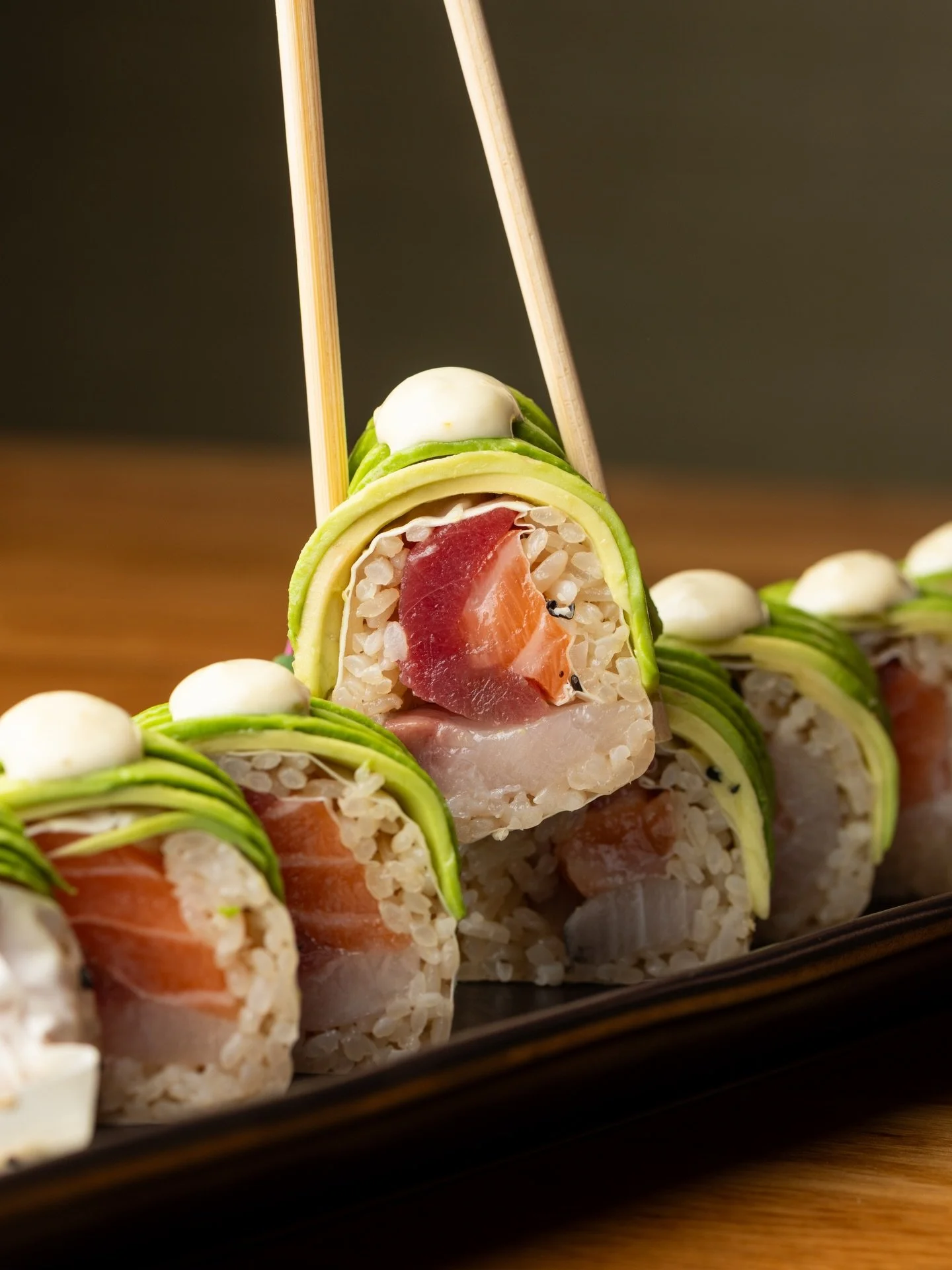 Osen Roll 🌊🥑

Fresh Bluefin tuna, salmon, and yellowtail wrapped in silky soy paper, topped with creamy avocado and a bright kick of yuzu mayo ✨

Vibrant, playful, and full of izakaya vibes &mdash; every bite is a little celebration at Izakaya Osen