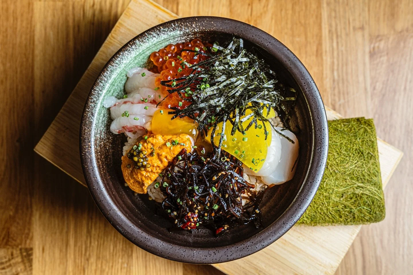 Uni amaebi dreams straight from the sea 🌊✨
A luxe bowl loaded with sea urchin sweet shrimp scallop ikura and caviar topped with a silky shoyu marinated yolk and that deep ocean umami from kajime nori.