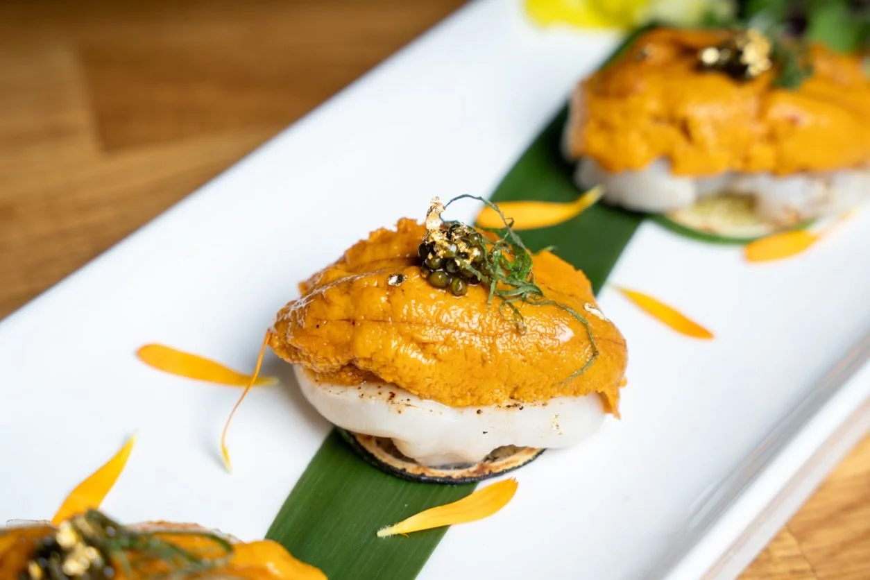 Uni Scallop Carpaccio ✨
Lightly seared scallop sashimi layered with fresh lime, topped with rich uni, caviar, and kizami shiso&mdash;finished with a delicate drizzle of amadare.
Bright, buttery, and perfectly balanced in every bite.