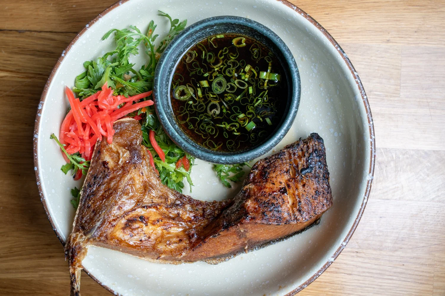 Perfectly grilled and packed with rich flavor 🔥
Our Hamachi Kama features charcoal-grilled yellowtail collar served with ponzu, fresh scallions, and a crisp side salad.

Crispy skin, juicy texture, and the perfect bite to pair with sake 🍶