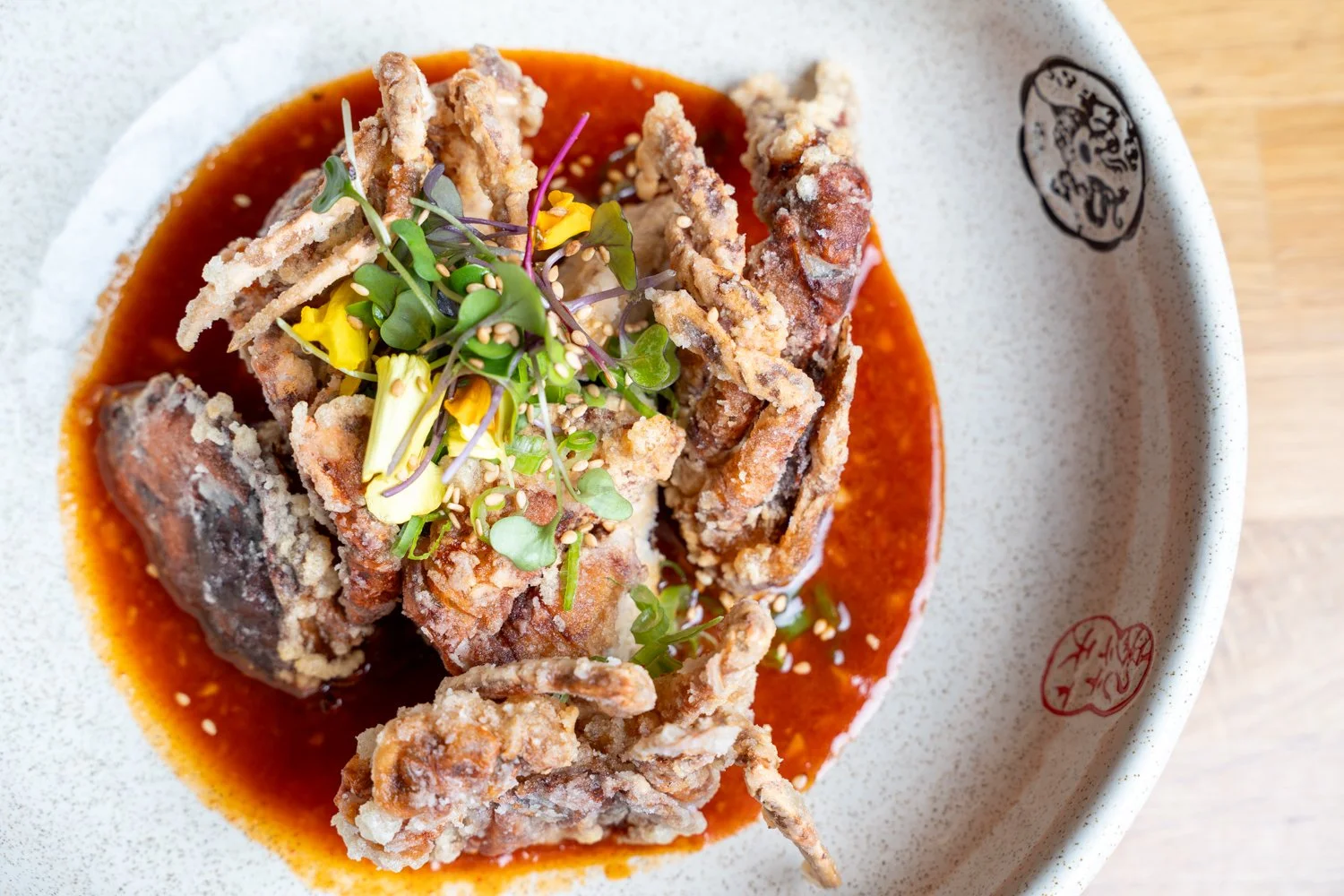 Crispy lightly fried soft shell crab served with fried eggplant and finished with our savory spicy sesame dressing. 🦀✨