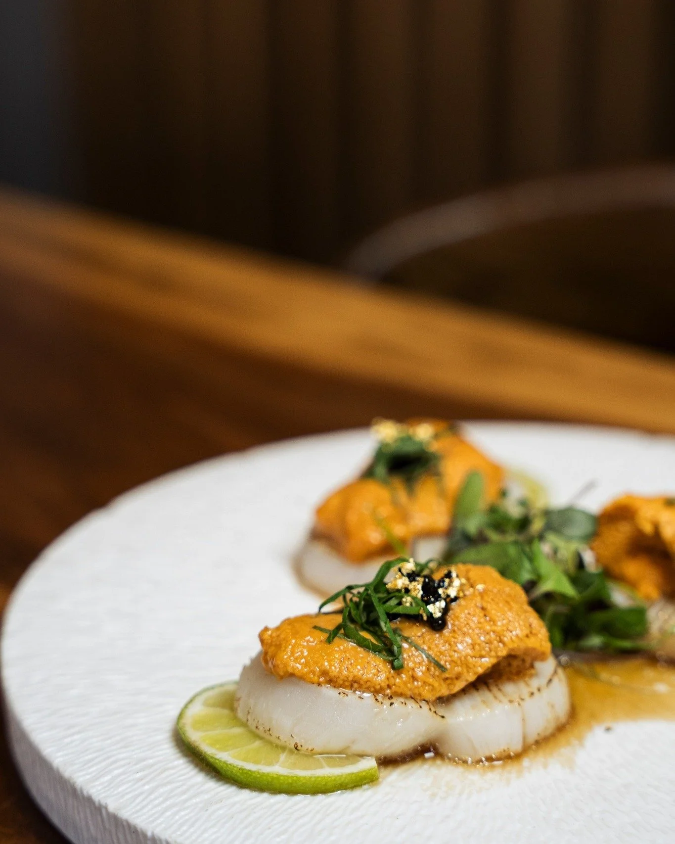 Uni Scallop Carpaccio
Scallop sashimi topped with sea urchin, shiso, and yuzu dressingScallop. Uni. Yuzu.

A delicate balance of sweetness, richness, and citrus.

#IzakayaOsen #UniScallopCarpaccio #Uni #Scallop #JapaneseCuisine #Sashimi #SeafoodLover
