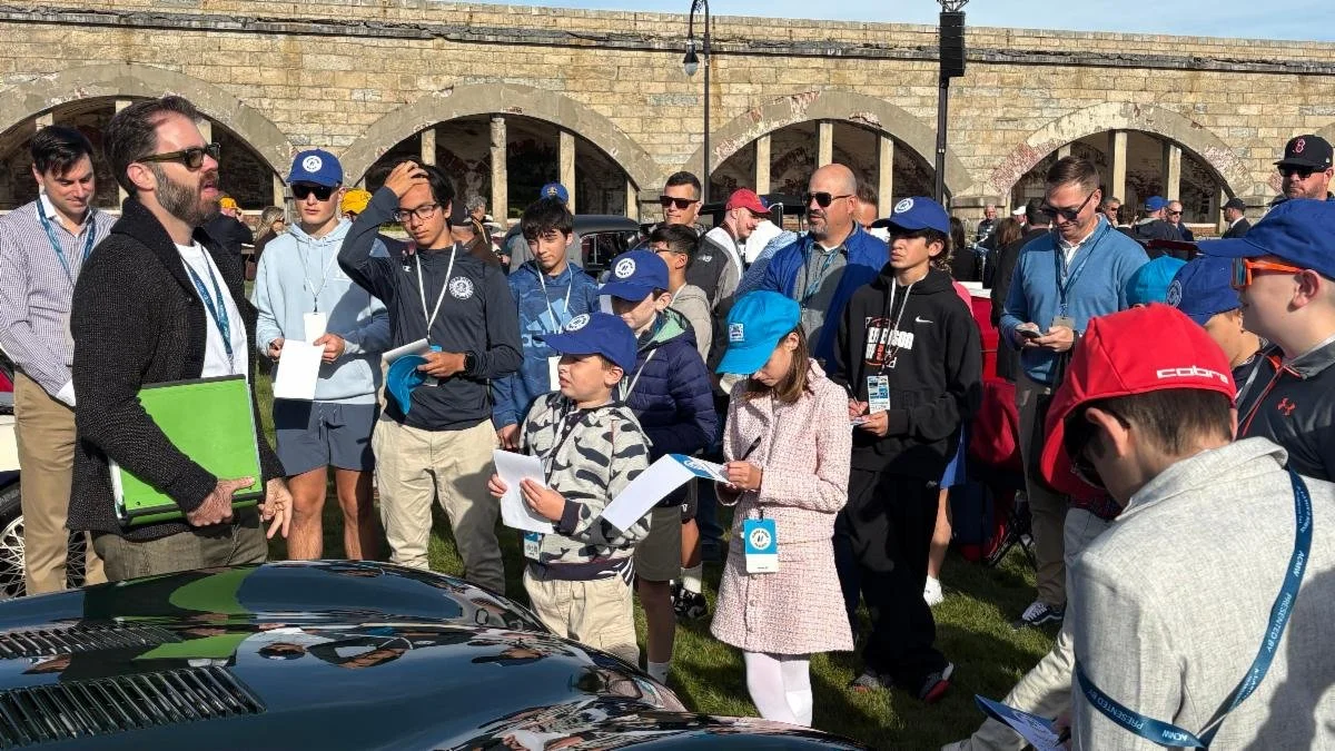 “See a Kid, Give a Book” Brings Collector Car Stories to Young Enthusiasts at Audrain Newport Concours &amp; Motor Week 2026