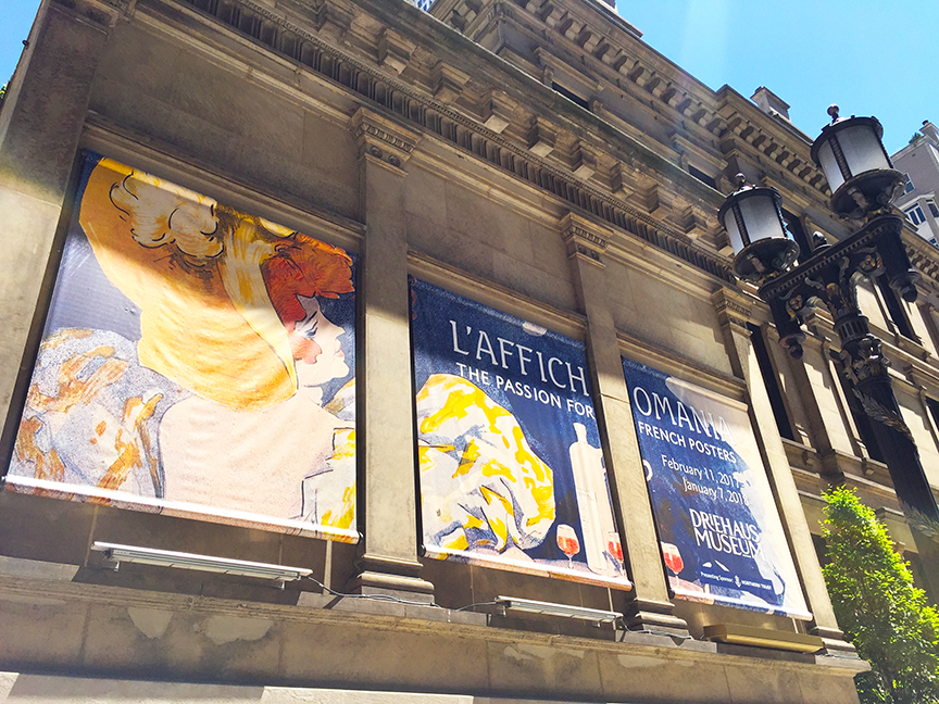 Promotional images on the side of the building on the Wabash Avenue side.