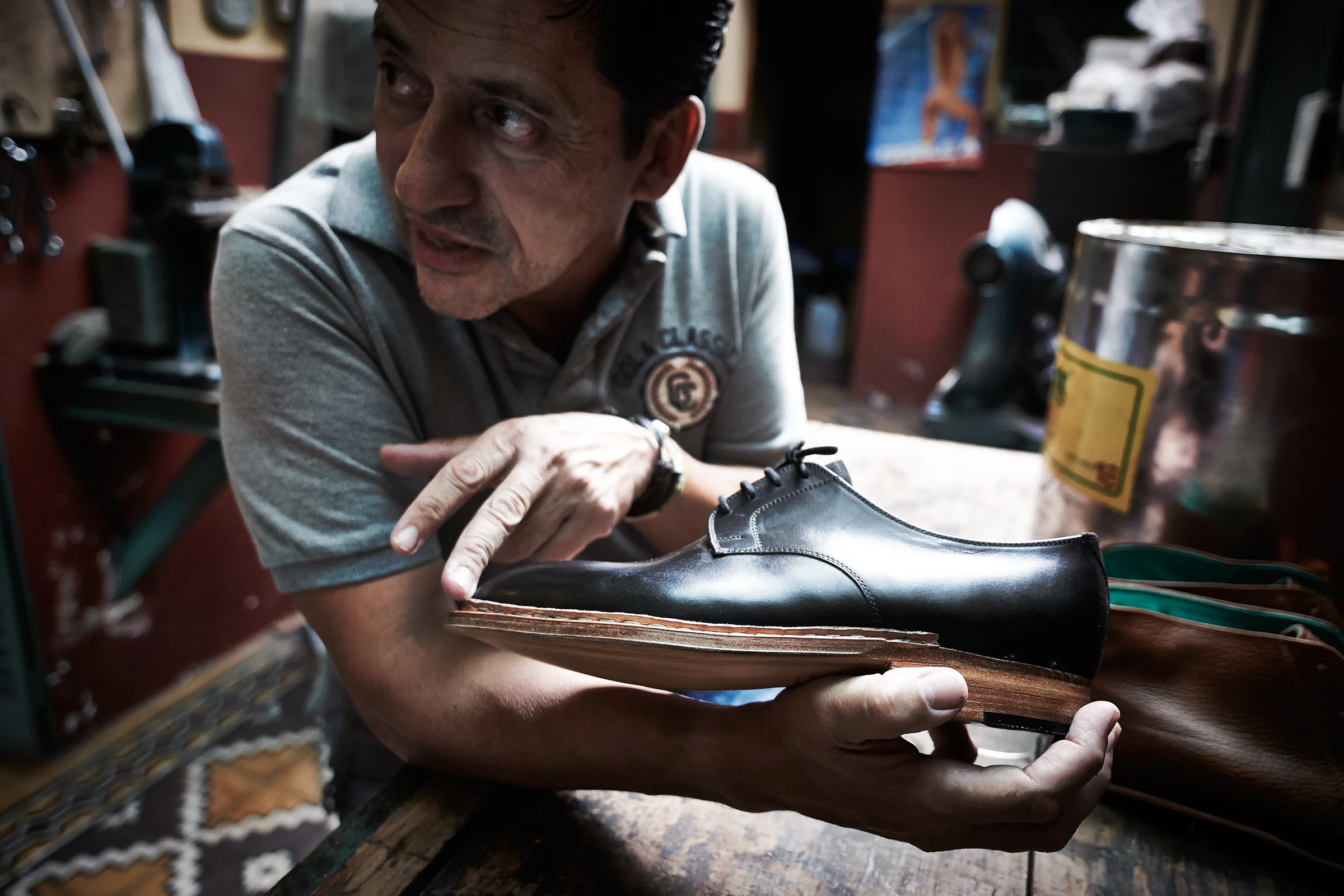 Dani with one of a half-made pair of shoes, Buenos Aires, Argentina (Photo: Anatol Kotte/The Other Hundred)