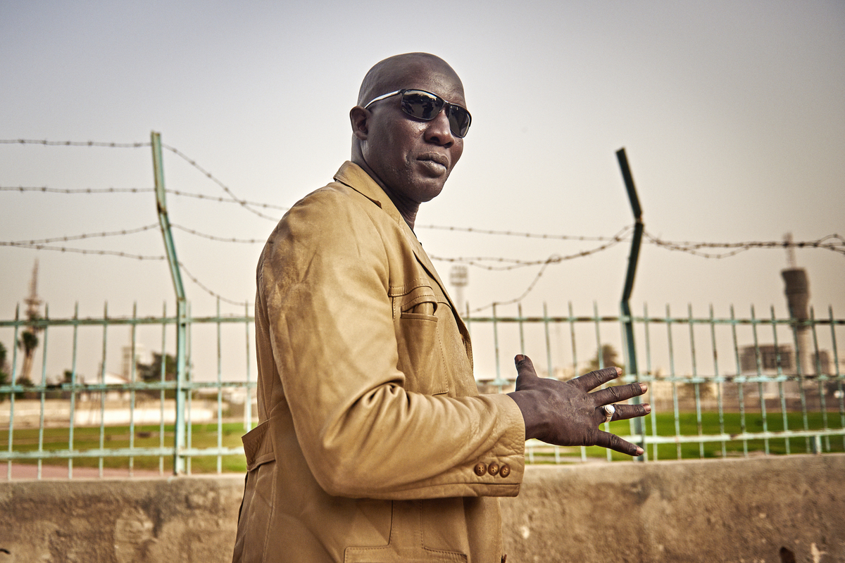  Lac stands before Dakar’s Mar Diop stadium, the site of his 2003 knockout victory over the Commando. 