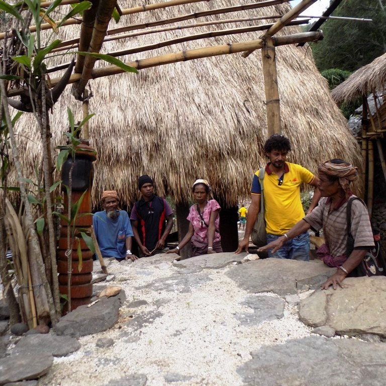  In Atabae, a village in western Timor-Leste, a traditional sea-salt maker explains the ways of his craft to Pedro (second right). 