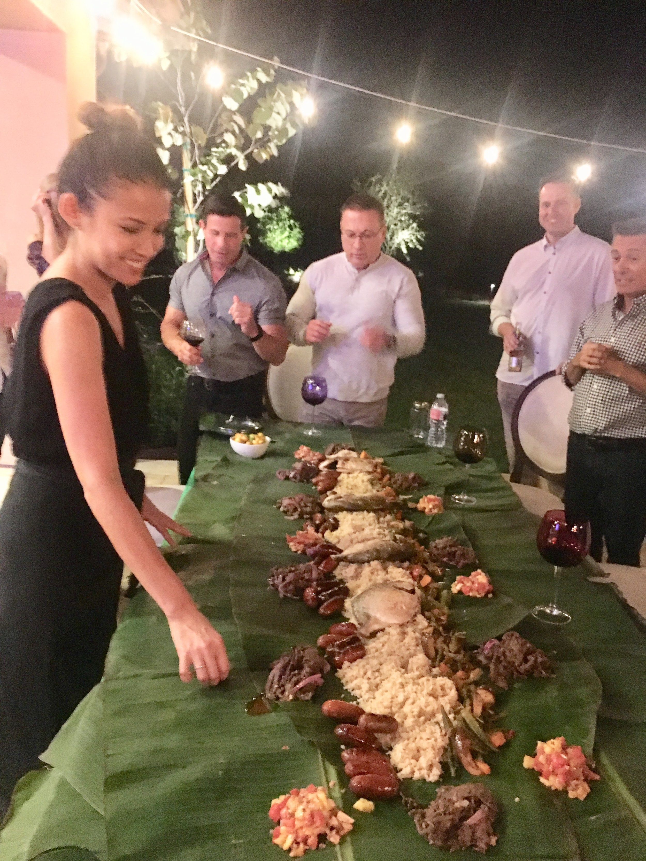 Feast Chef Camille Food is prepared and arranged along banana leaves for a group to eat entirely by hand; feast chef camille