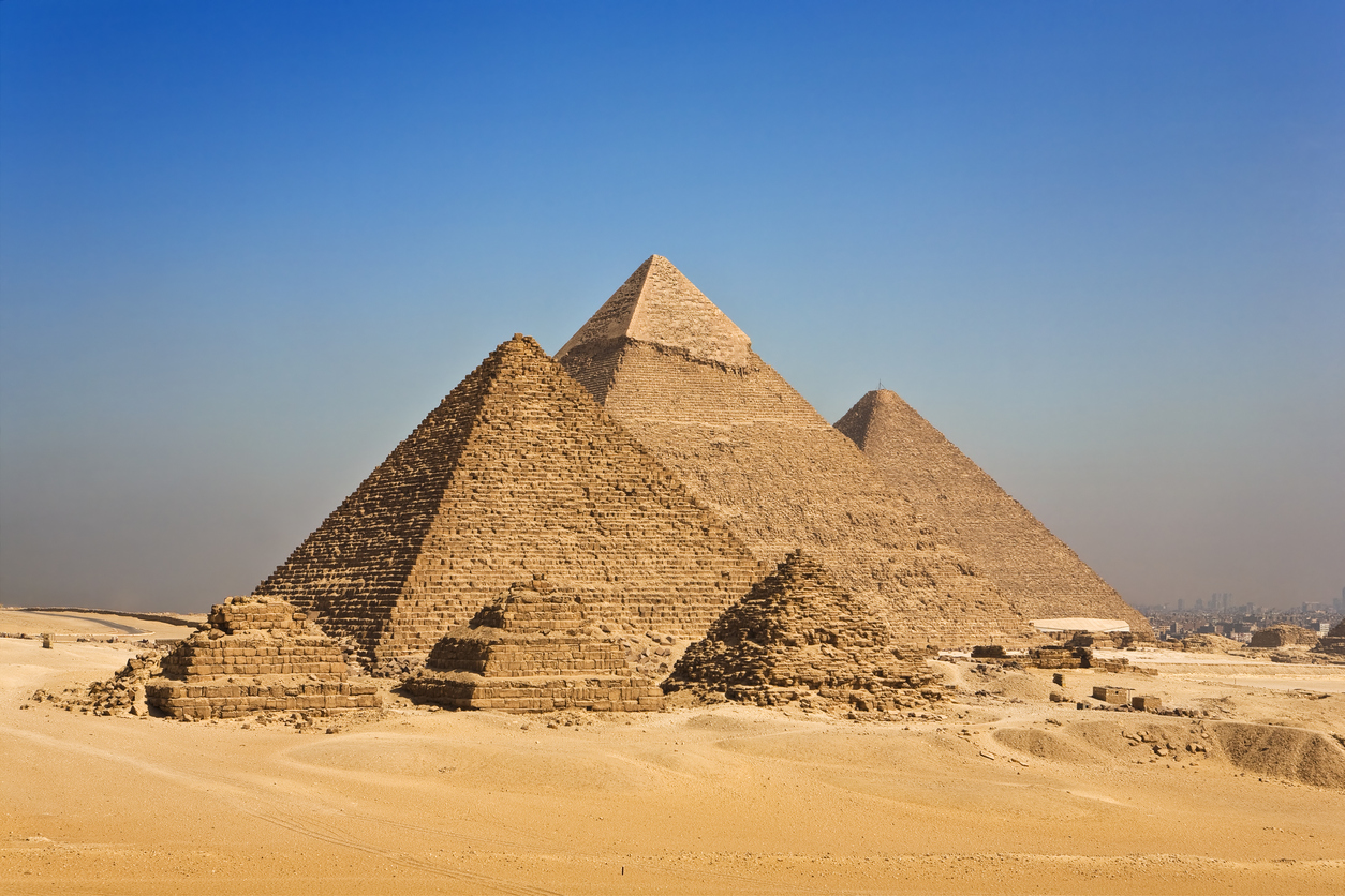 Pyramids-of-Giza-against-blue-sky-in-Cairo,-Egypt-136212044_1255x837.jpeg