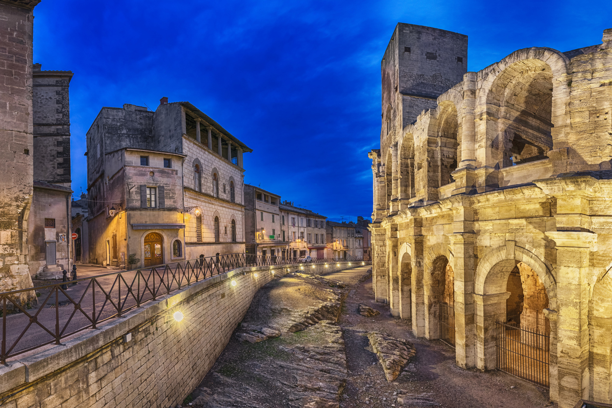 Roman-amphitheatre-at-dusk-in-Arles,-France-902228190_1258x838.jpeg