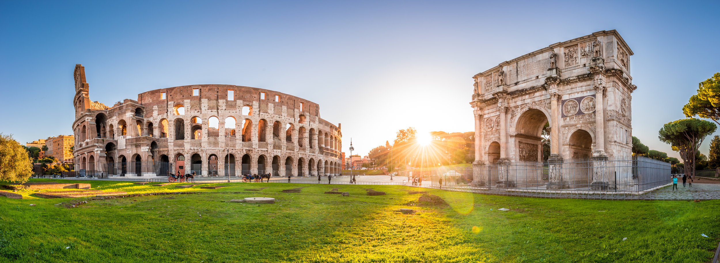 Colosseum-and-Constantine-Arch-at-sunrise,-Rome.-Panorama-641372858_7034x2574.jpeg