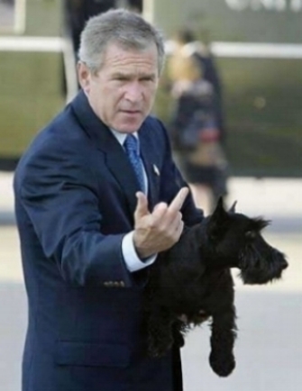 Bush gives the bird to America in front of reporters in 2004 when asked about WMDs. in Iraq...