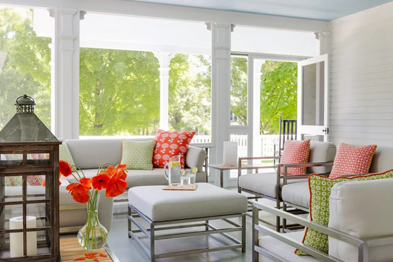 An inviting screened porch that flows from the front porch of a recent renovation by Ramsay Gourd Architects.