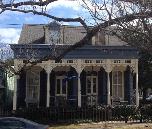 Double Shotgun House with a High Victorian Porch