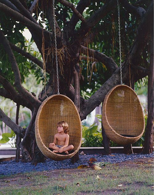 child in hanging egg chair.jpg