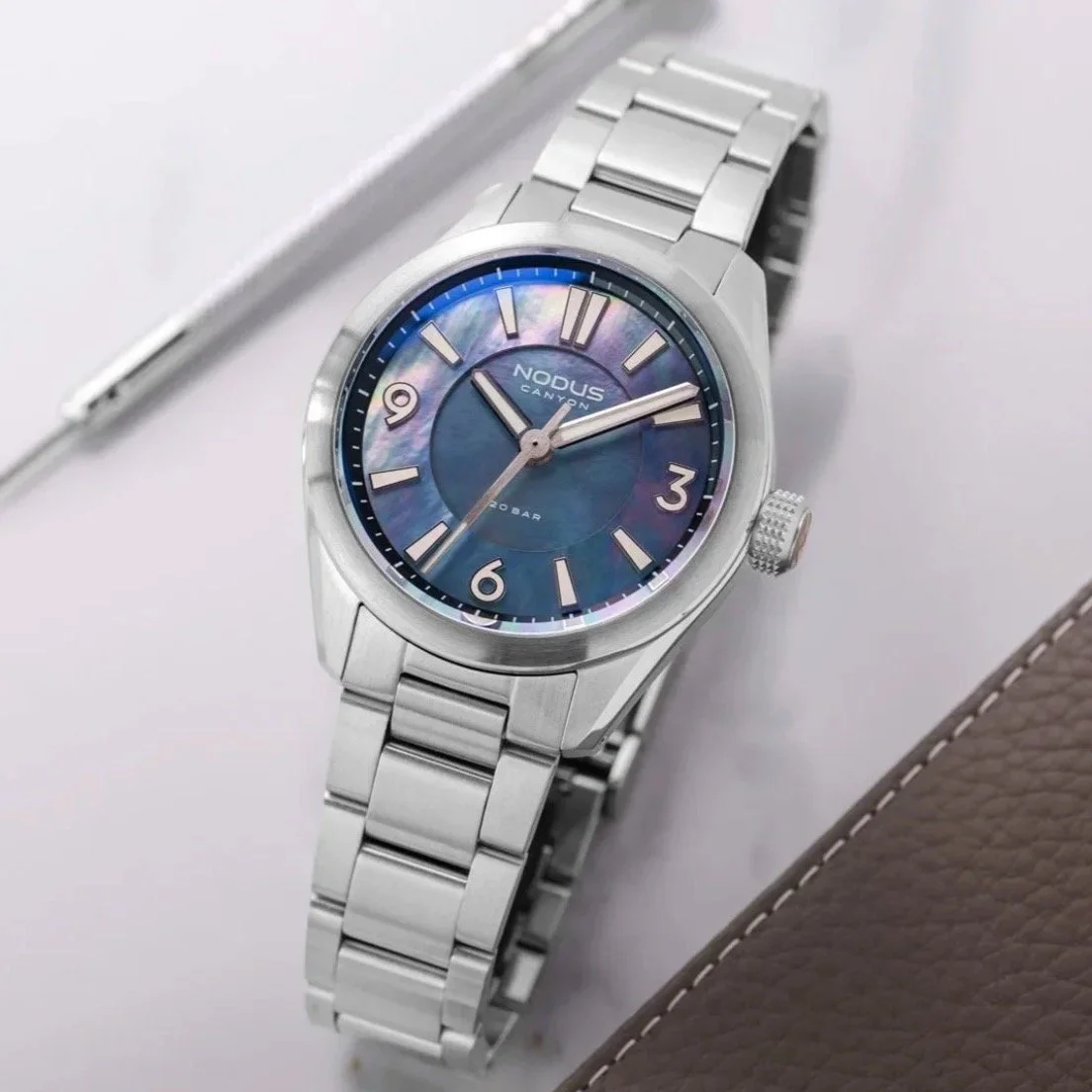 It's time! The @noduswatches Canyon *Black Pearl* is here! The final variant of our five-watch run, the Black Pearl features a sectored, natural Tahitian Black Pearl dial, ensuring no two watches are alike. The dials radiate with grays, blues, purple