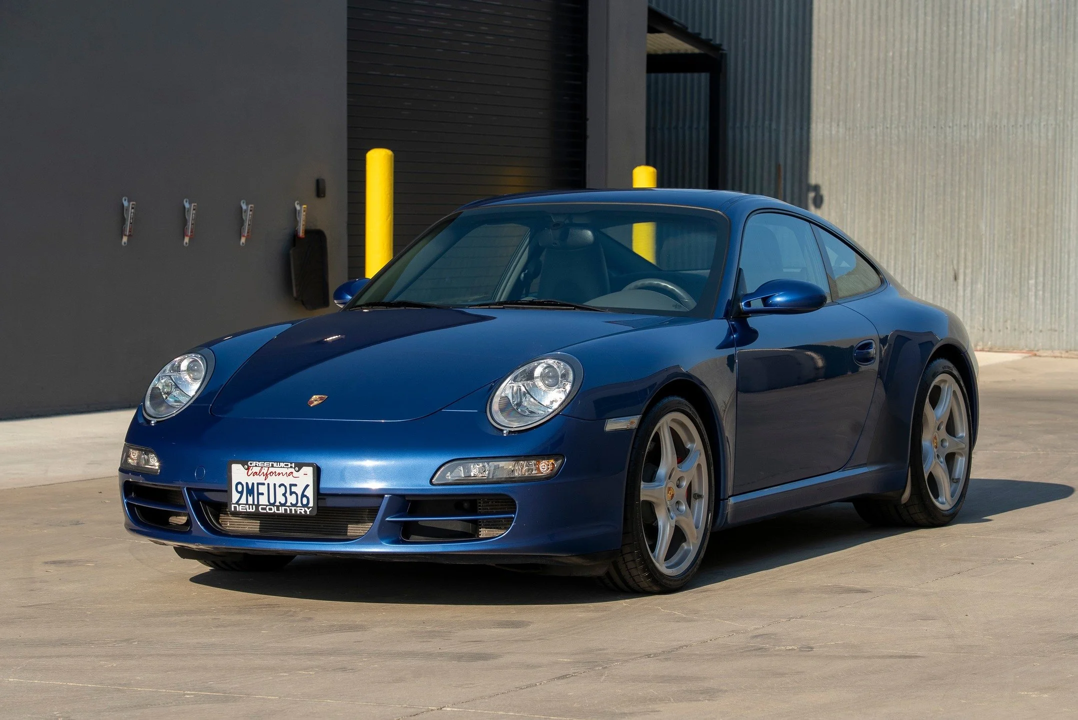 Cool Commuter Alert! @westsidecollectorcarstorage is proud to present this absolutely lovely Cobalt Blue 2007 997 Carrera S coupe with just 43k miles on @bringatrailer . Yes, it is a tiptronic, which means most people won't want it. But I drove it fo