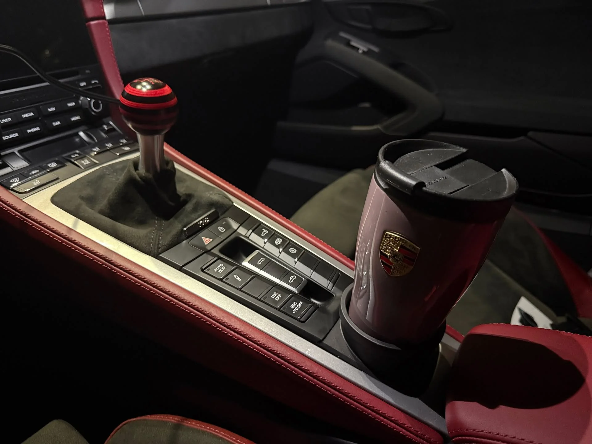 Interior upgrades for the Spyder! @builtbybasil made me a stunning color-matched shift knob from bloack ash and red skateboard decks! and I got the @kaizenkups 992-style cupholder to replace the mostly useless coin tray. Fits the matching mug perfect