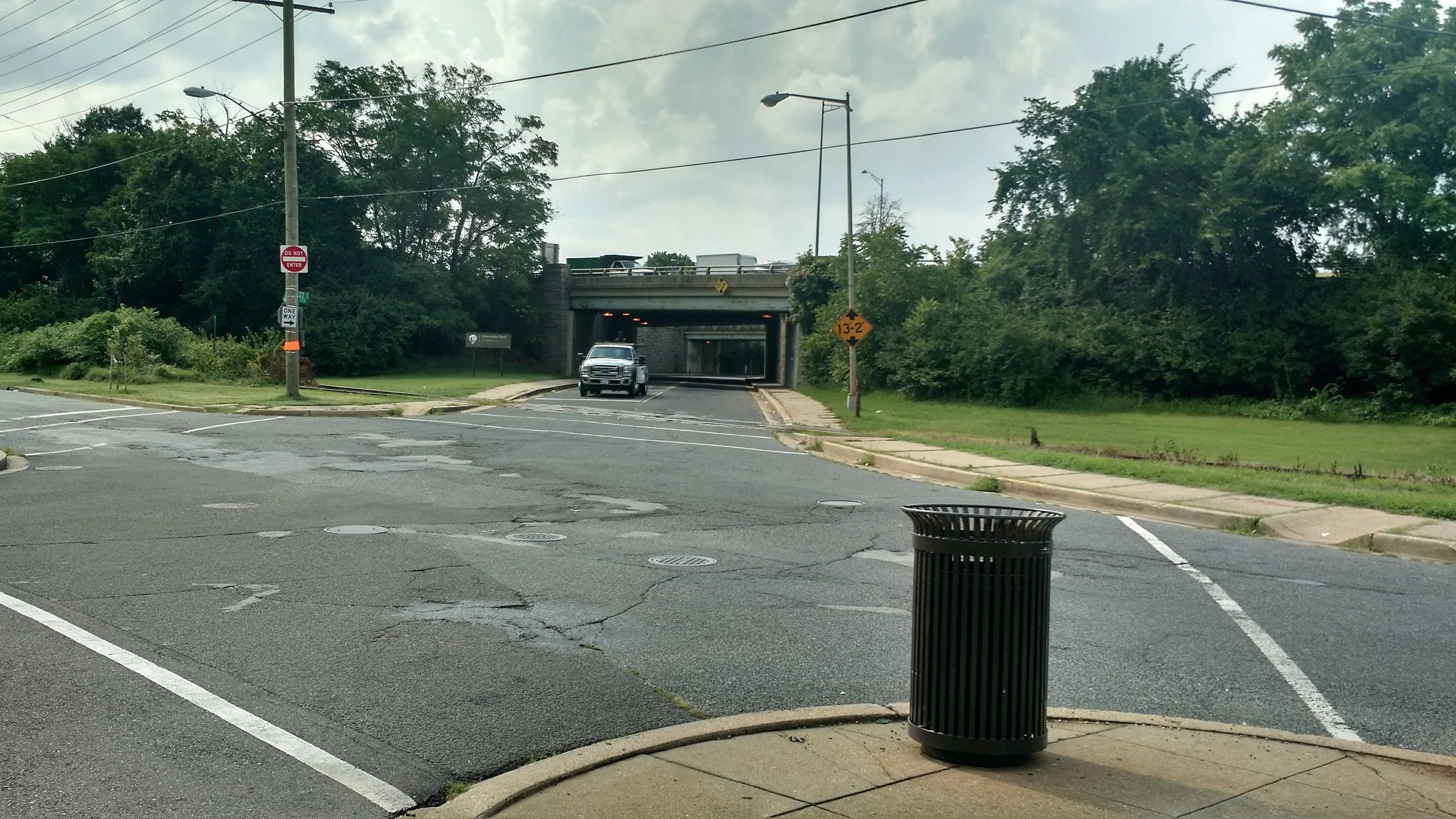 This is a view from the Fairlawn neighborhood into the entrance to Anacostia Park. That is a long and dark distance to walk as a pedestrian. Can you spot the sign that lets you know you've entered a nationally significant park? 
