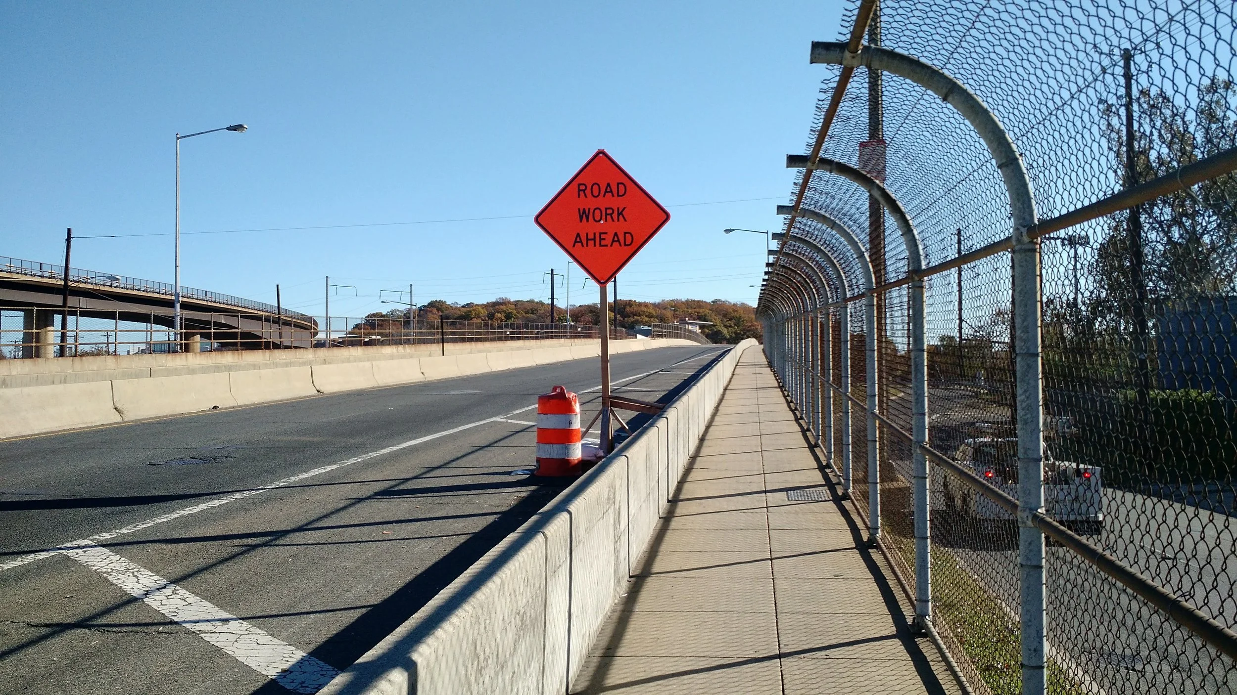 This cramped sidewalk next to blaring traffic is the only pedestrian AND bicycle route to the waterfront from the neighborhoods near the Minnesota Avenue and Benning Road Metro stations. There is no sidewalk on the other side of this bridge over the railroad. 