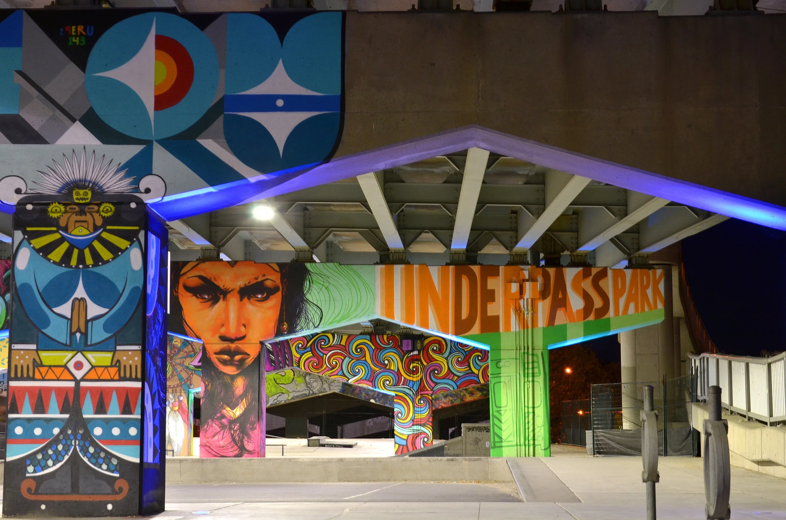 From blog.waterfrontoronto.ca: "The riotous graffiti artwork at Underpass Park takes full advantage of the imposing concrete beams and columns to create a fun and energetic atmosphere (Photo credit: Nicola Betts)."