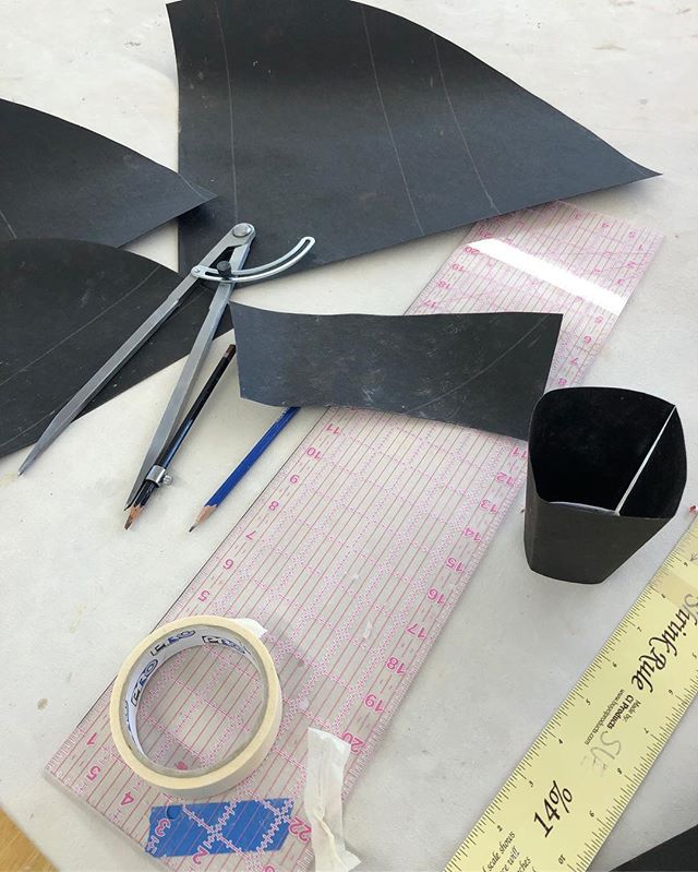 Creating new templates for handbuilt cups using my new mega steal compass. Finally I can draw large circles and arcs. I use tar paper to make the templates so that they are very durable. #slabbuiltmug #slabbuiltceramics #slabbuilding #handmade #handb