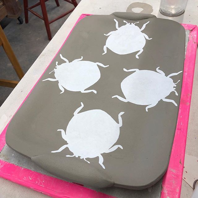 Working on a new platter design using paper resist. Great thing about paper resist is that you can experiment with different compositions and patterns with the paper cutouts before settling on a final design. #ceramica #ceramics #pottery #instacerami