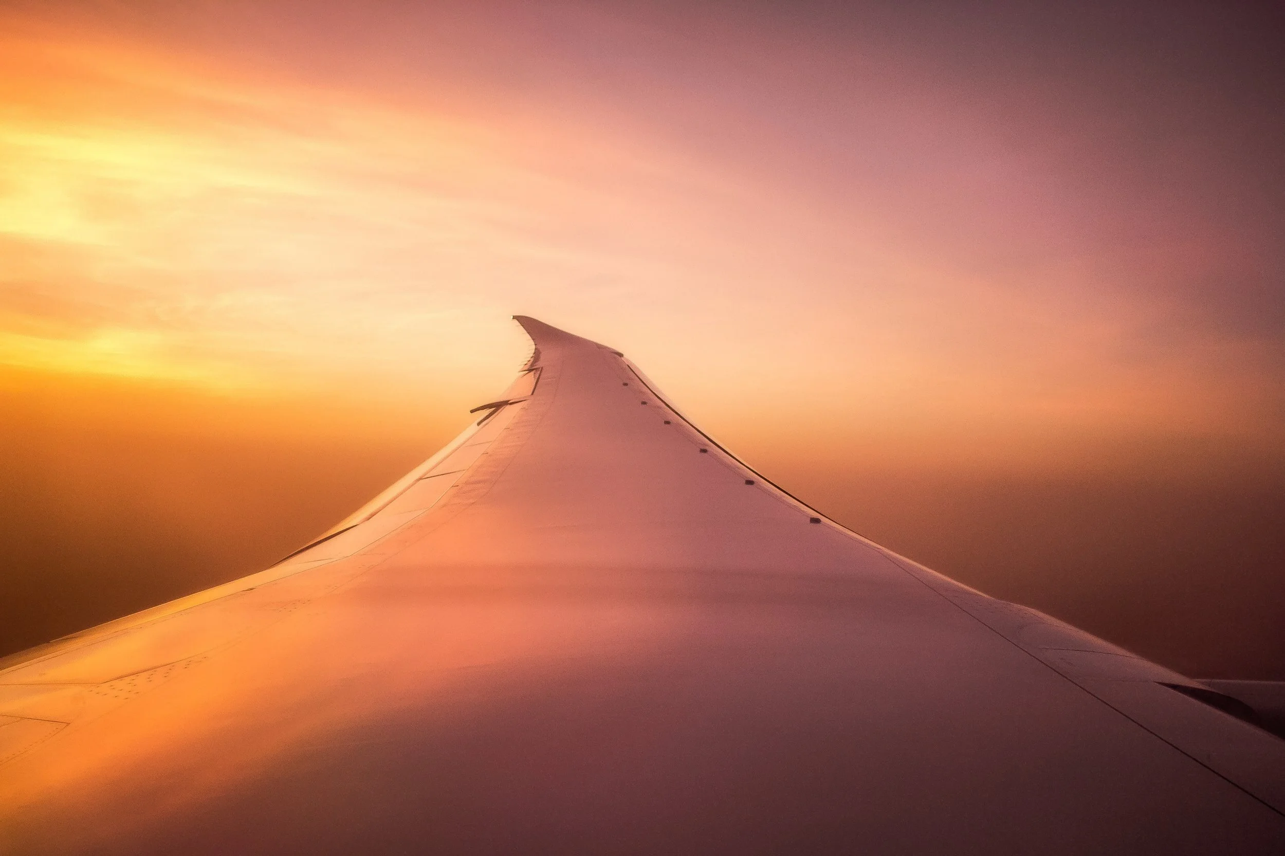 Plane wing at sunset.jpg