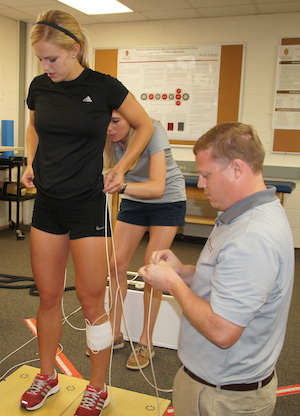 Assistant Professor of Kinesiology, David Bell in lab.