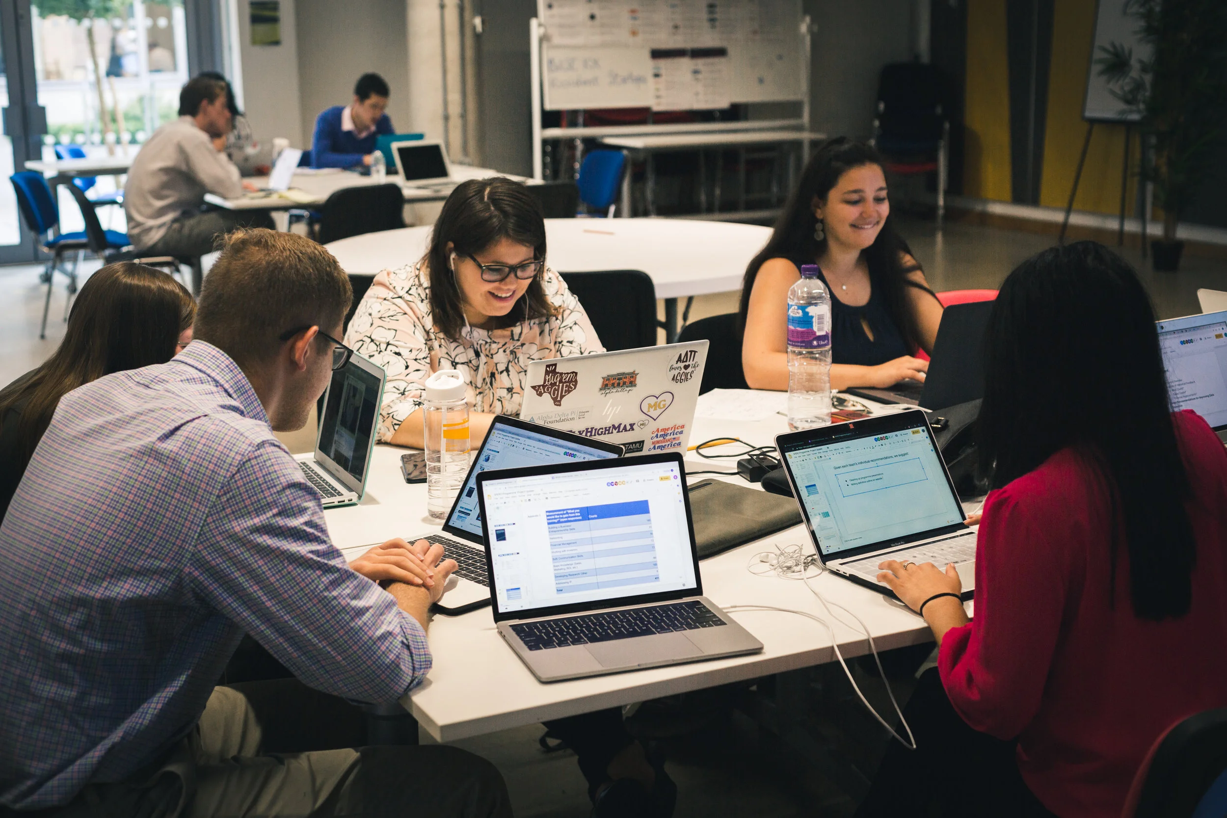 2019 Fellows refine slides during project work at the BaseKX client site near the UCL campus in London.