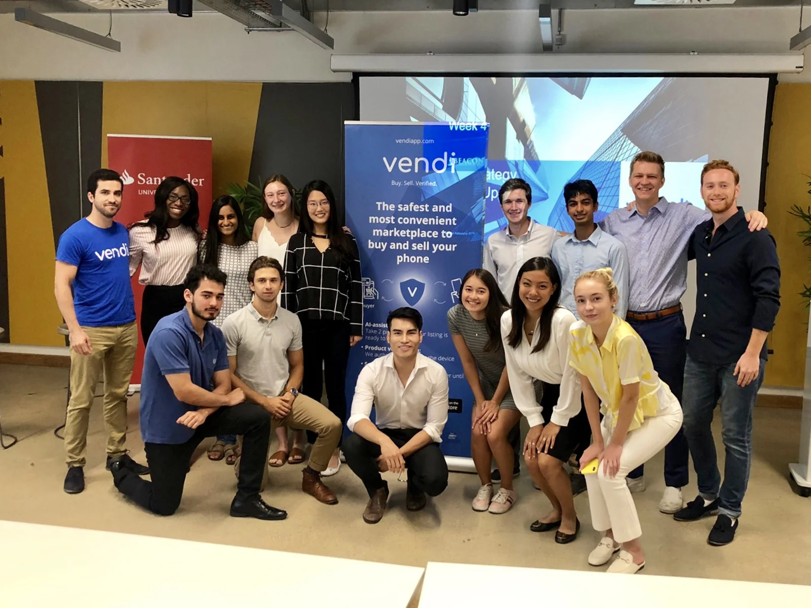 Viet N., 2019 Project Lead who spent 3 years at McKinsey and now leads a business strategy division at Google, poses with Fellows at the BaseKX client site.
