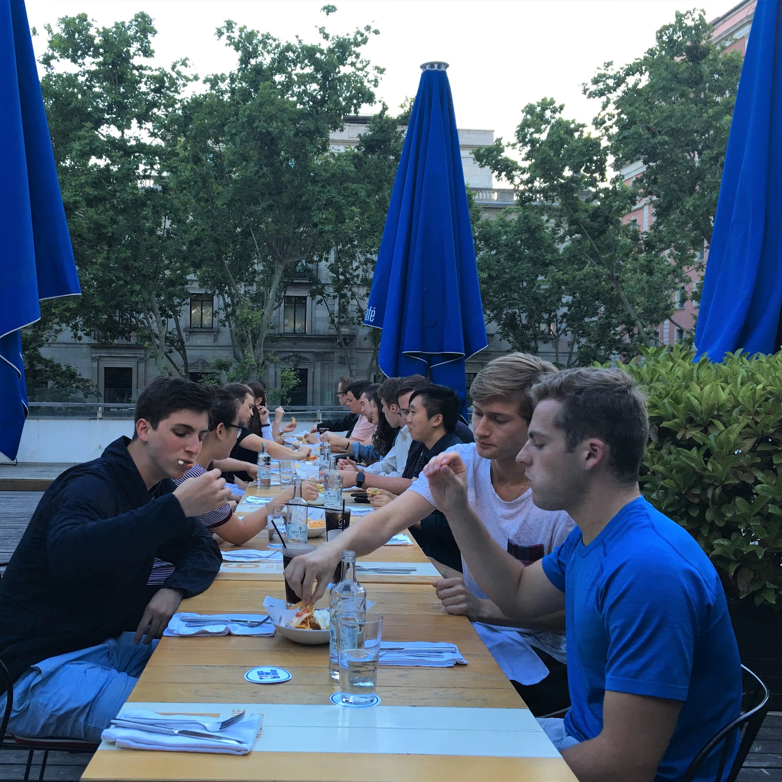 Fellows enjoy an afternoon meal in Madrid.