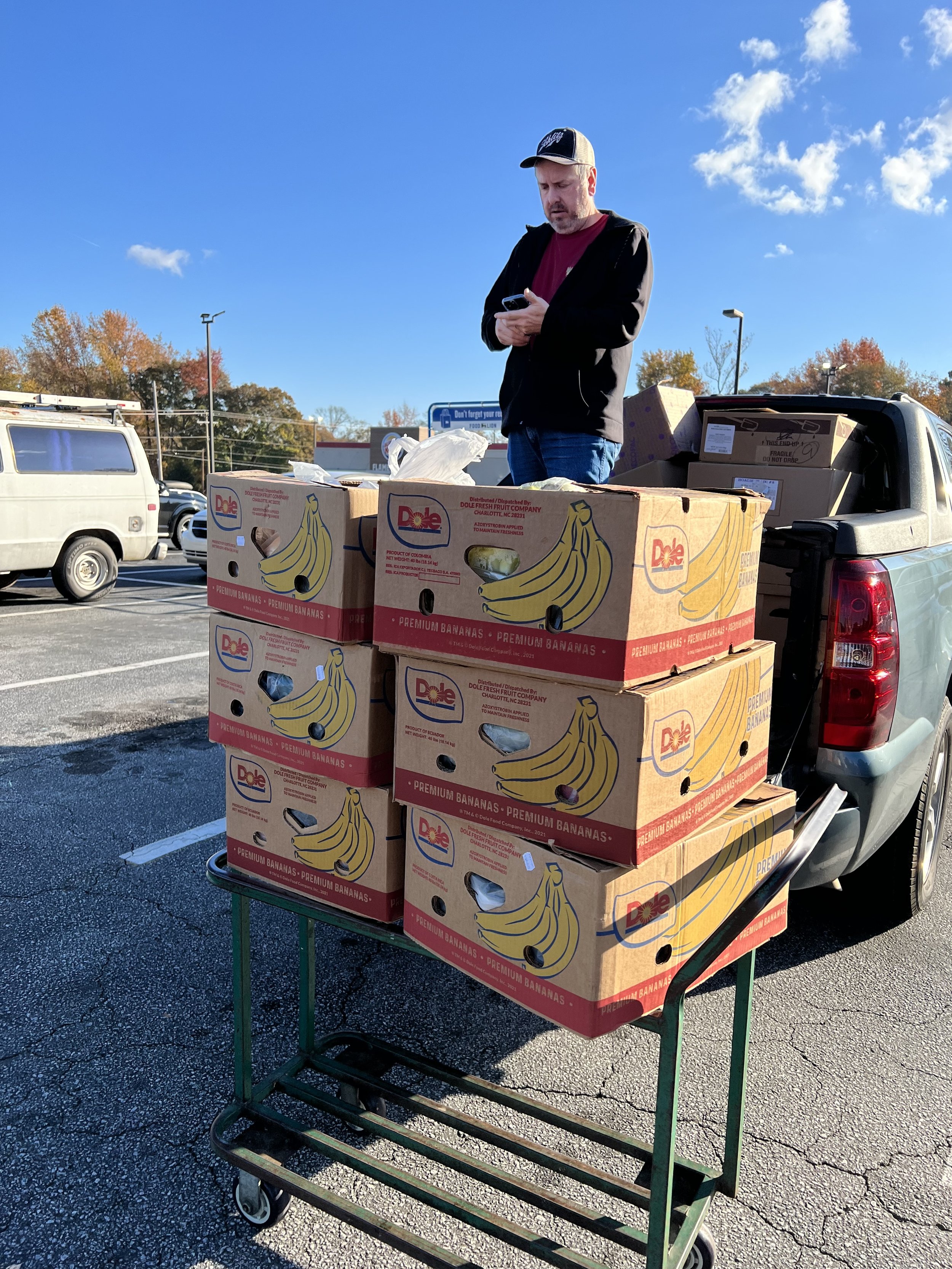 Gabe loading up donated produce 