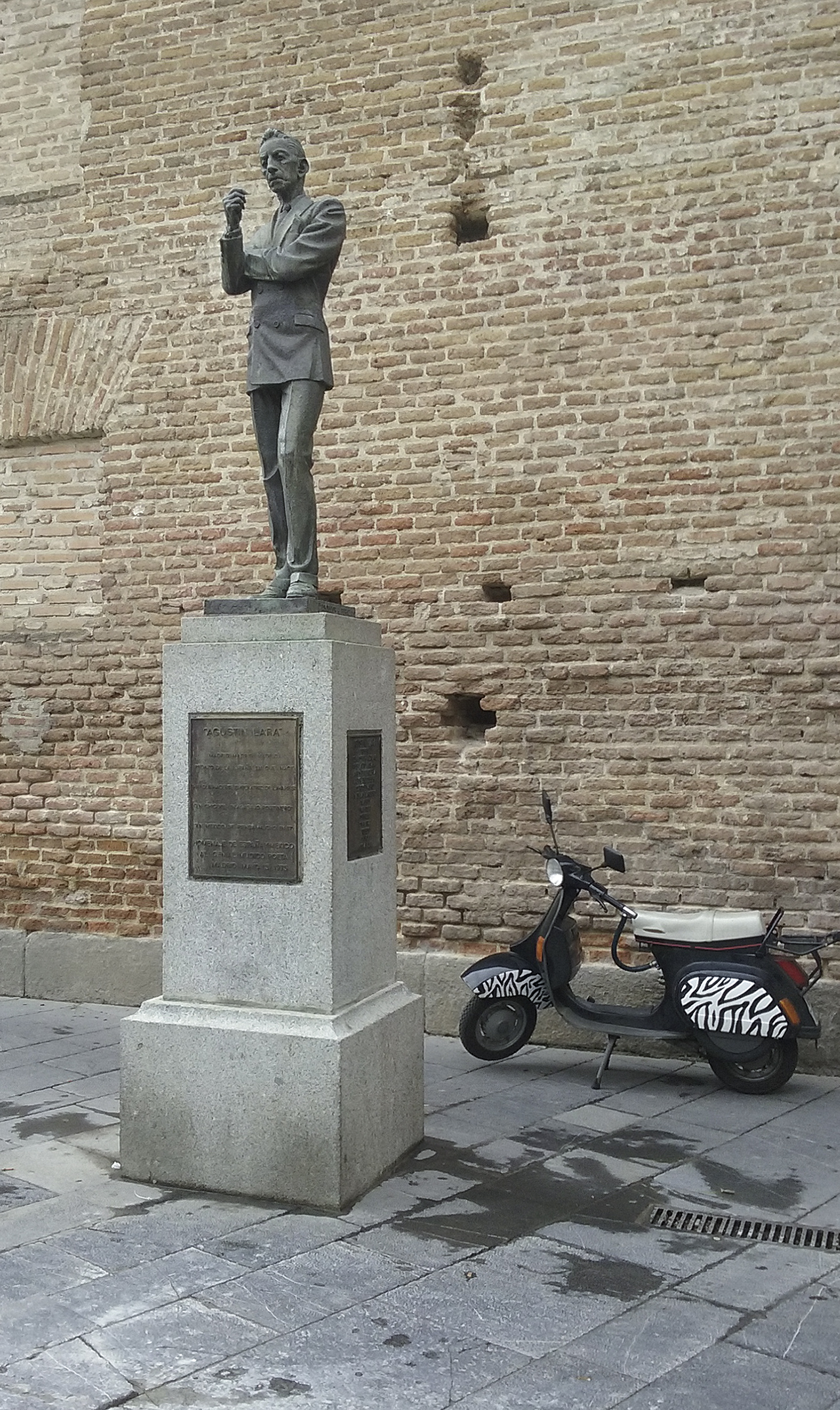  Augustine Lara contemplates Madrid as a Mod Vespa sits patiently awaiting it's owner. 