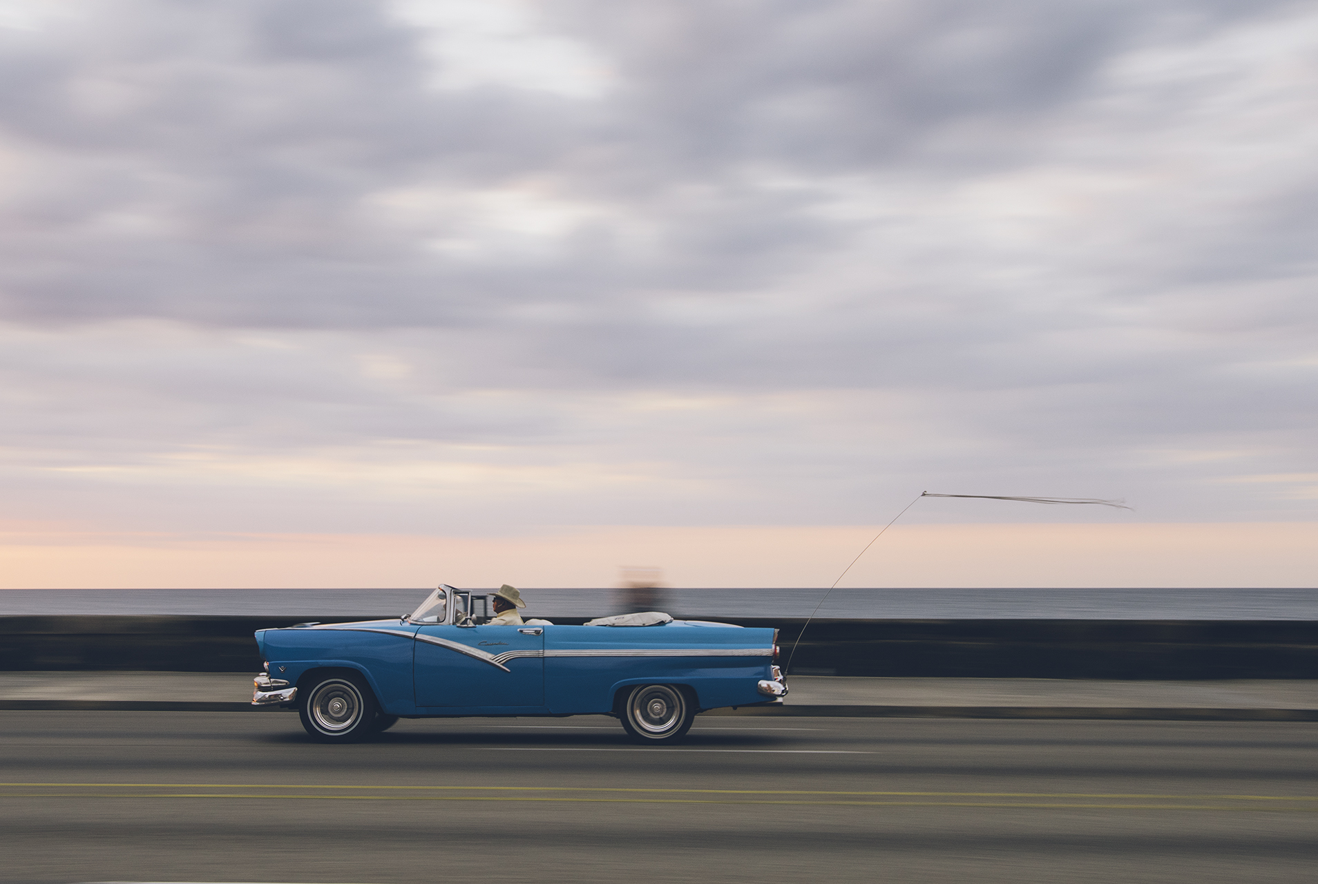  A cherry 1956 Ford Fairline along El Malecon. 